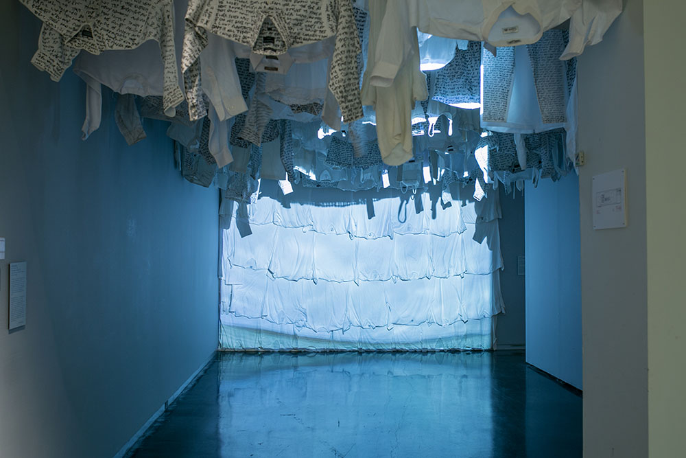  Malcolm McClay’s   Swimming to Inishkeel   installation with video projection and clothes 
