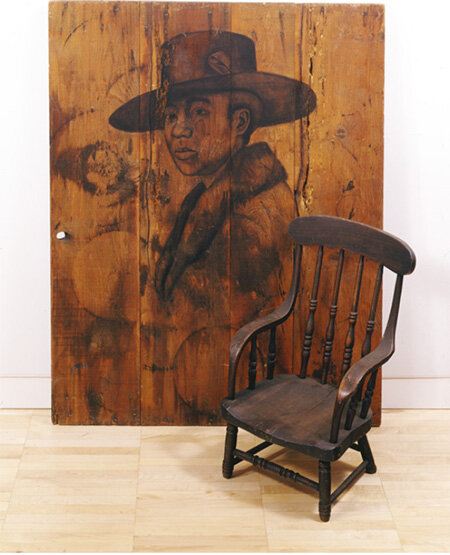 Whitfield Lovell, Cada Dia, 2004, charcoal on wood, chair; LSUMOA 2021.1 a,b Purchased with funds from Winifred and Kevin Reilly