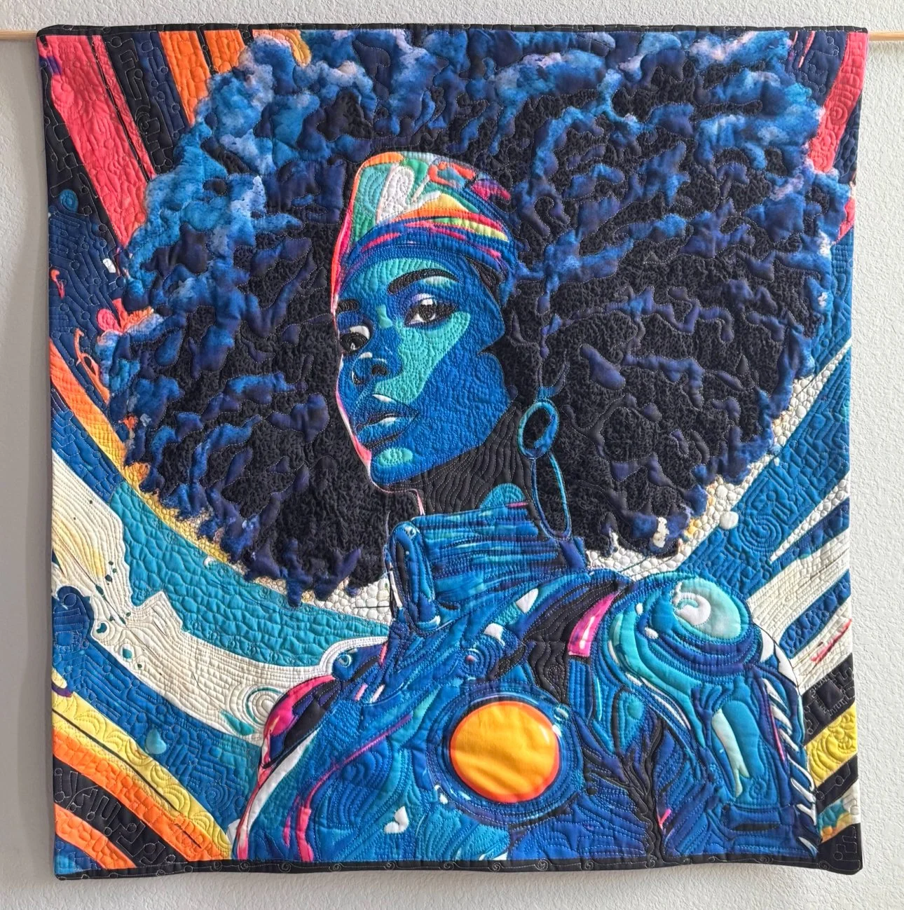  Earamichia Brown,  Force of Nature , 2024. Cotton textiles, batting, and a combination of cotton and polyester threads; trapunto, hand quilting, machine quilting, digital printing. Courtesy of the artist and Studio Art Quilt Associates. 