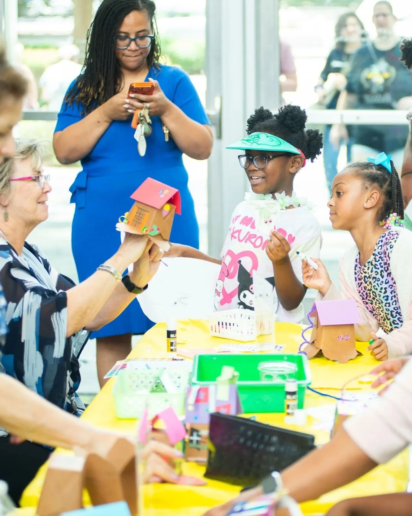 People creating art at a table during Free First Sunday at the LSU Museum of Art.
