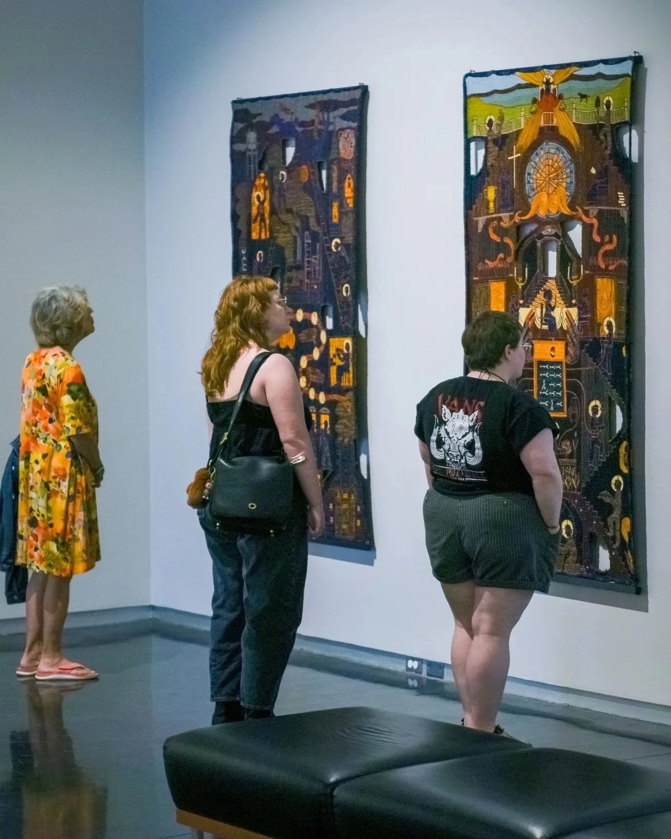 People in the Galleries looking at artwork.