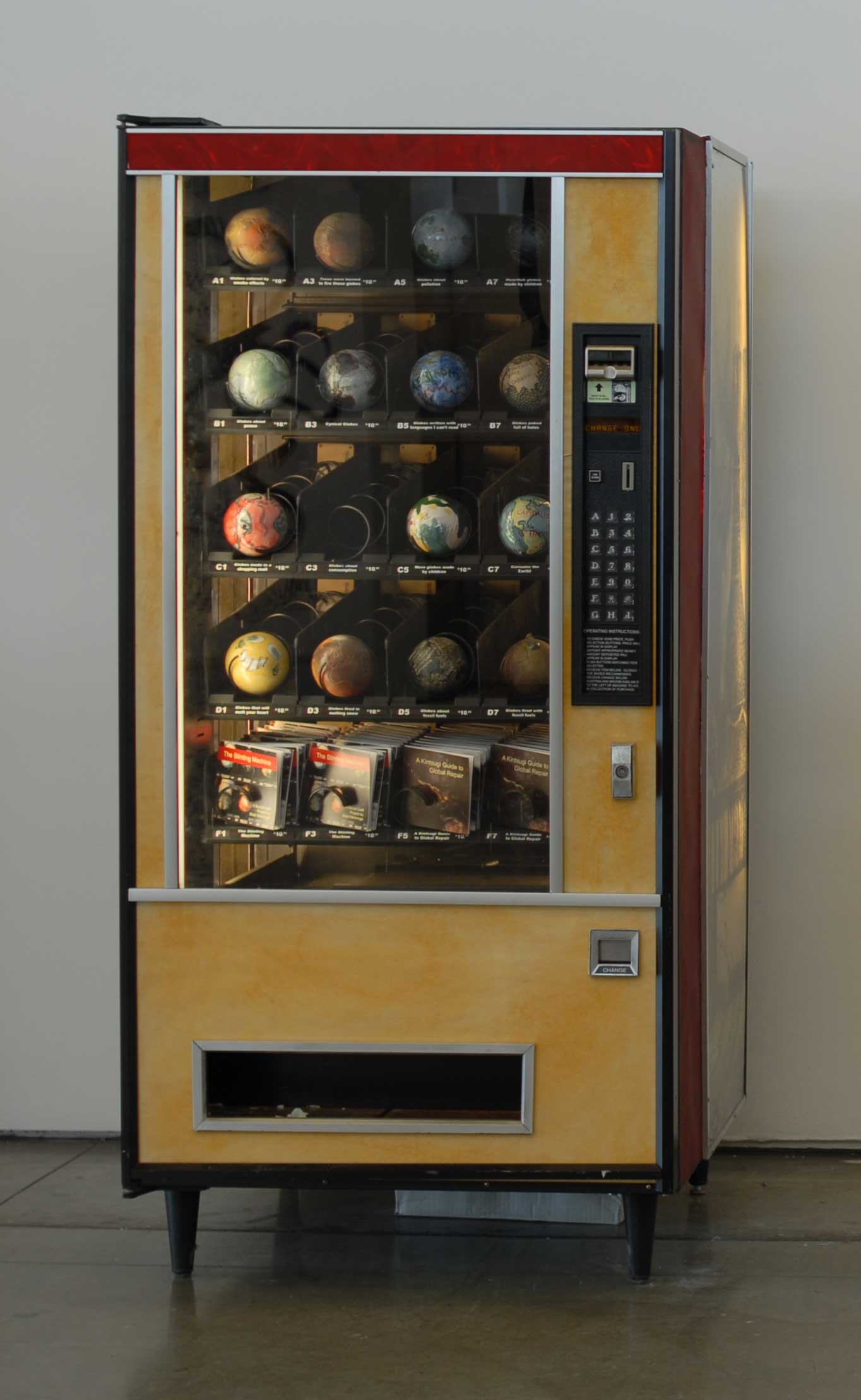  The vending machine was designed to drop and break handmade ceramic globes if they were purchased. 