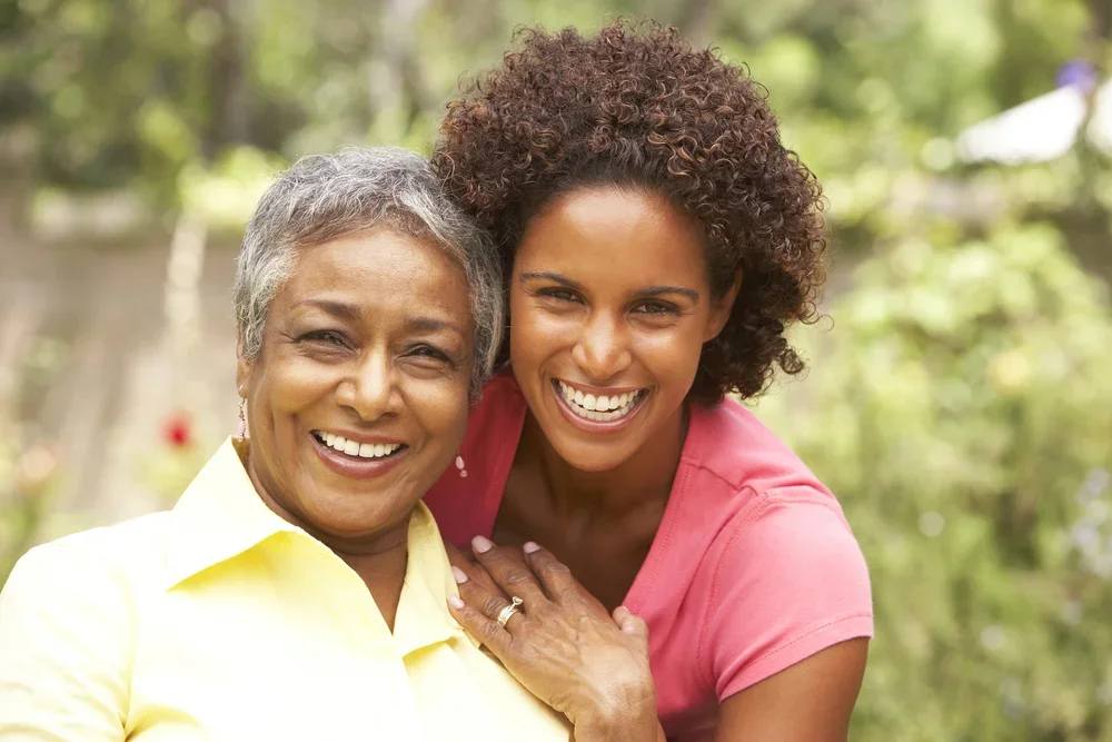 woman and mother smiling together