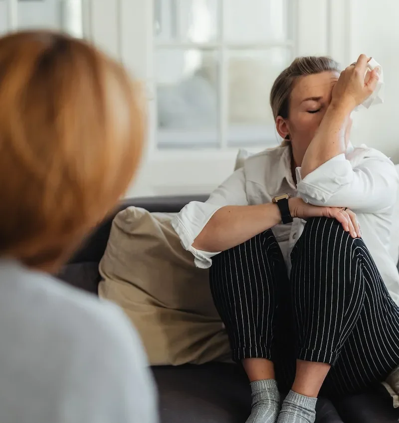 woman crying in therapy session