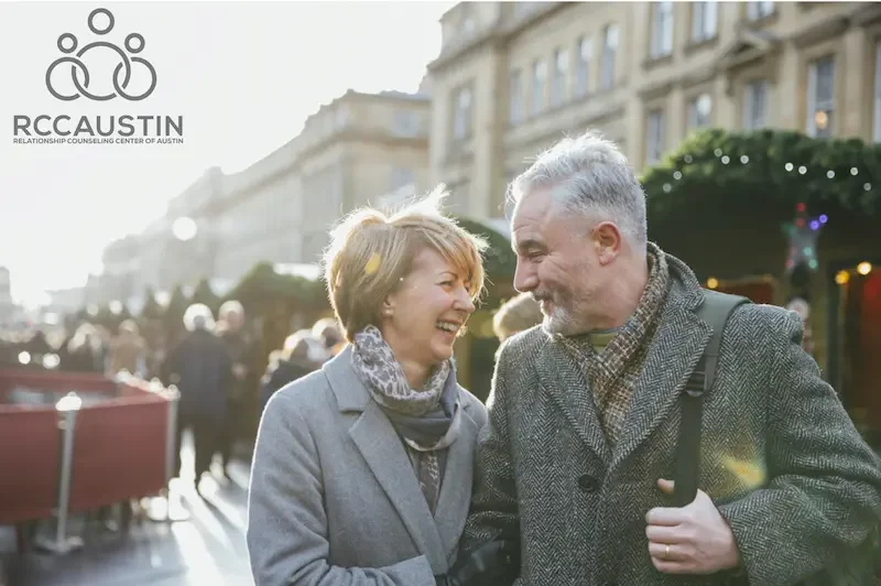 couple walking in city smiling at each other