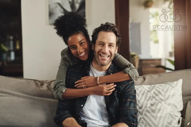 woman with arms around mans shoulders both smiling