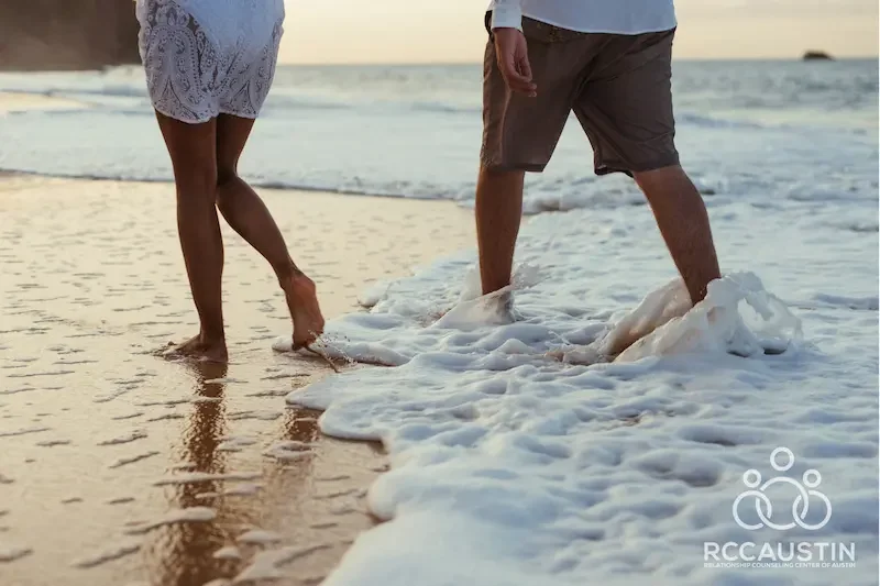 couple walking in ocean