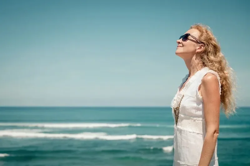 woman looking out at ocean