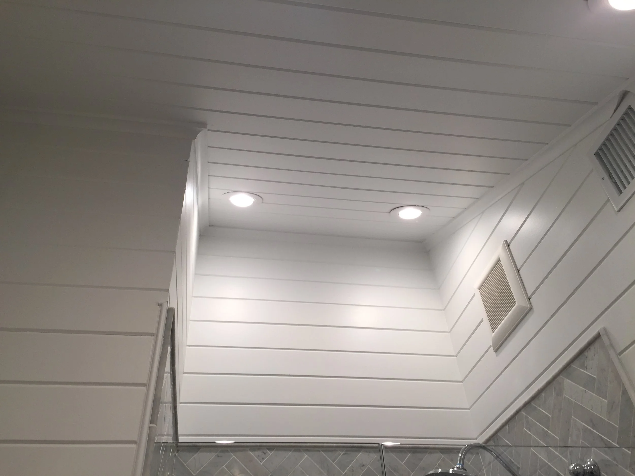  converted standard ceiling in shower stall to vaulted ceiling adding height and the feeling of more space in a small area 