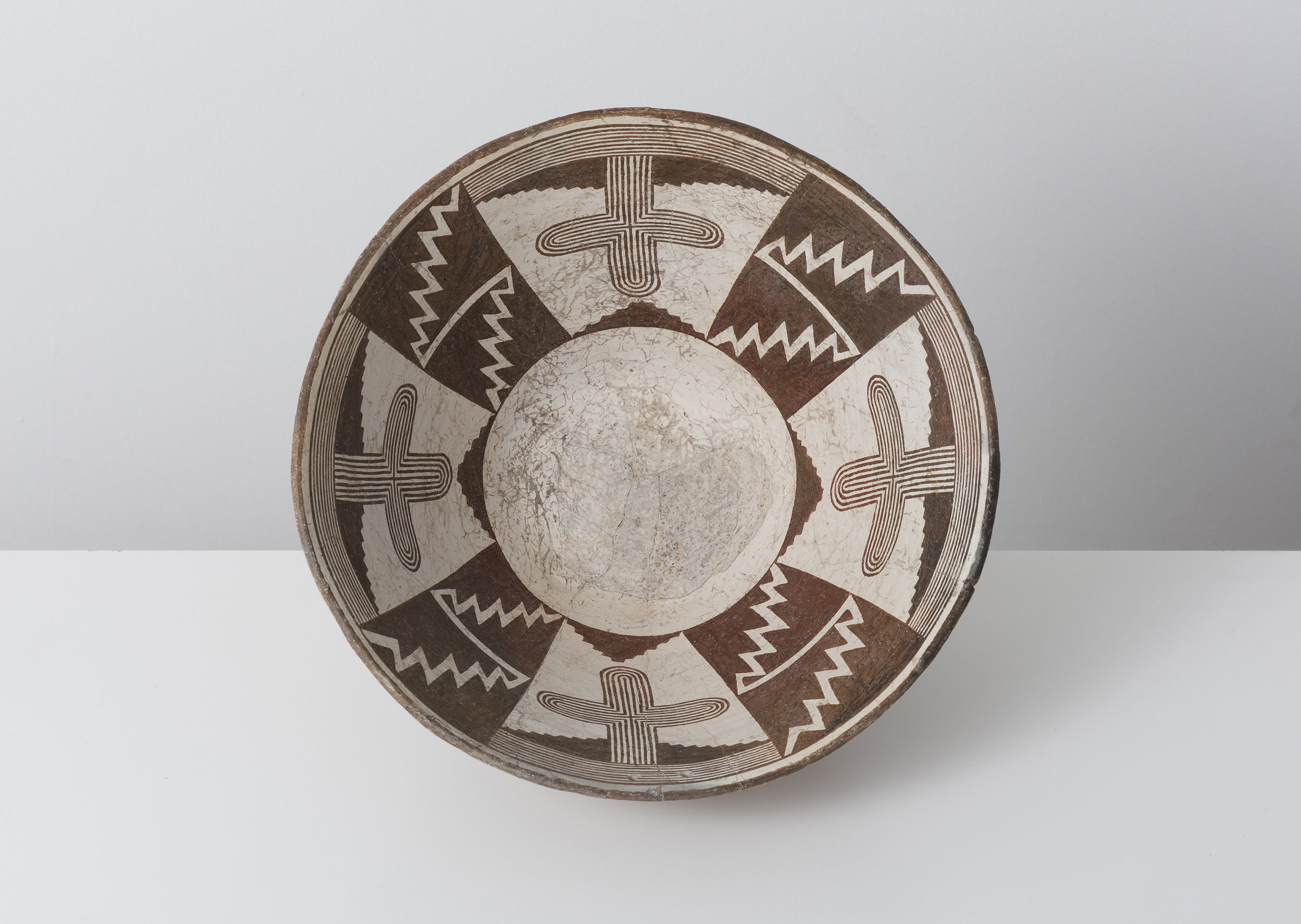   Classic Mimbres Black-on-white  Saguaro cactus and entoptic cross pattern c. 900 - 1000 CE Painted ceramic 11 inches diameter, 6 inches depth    