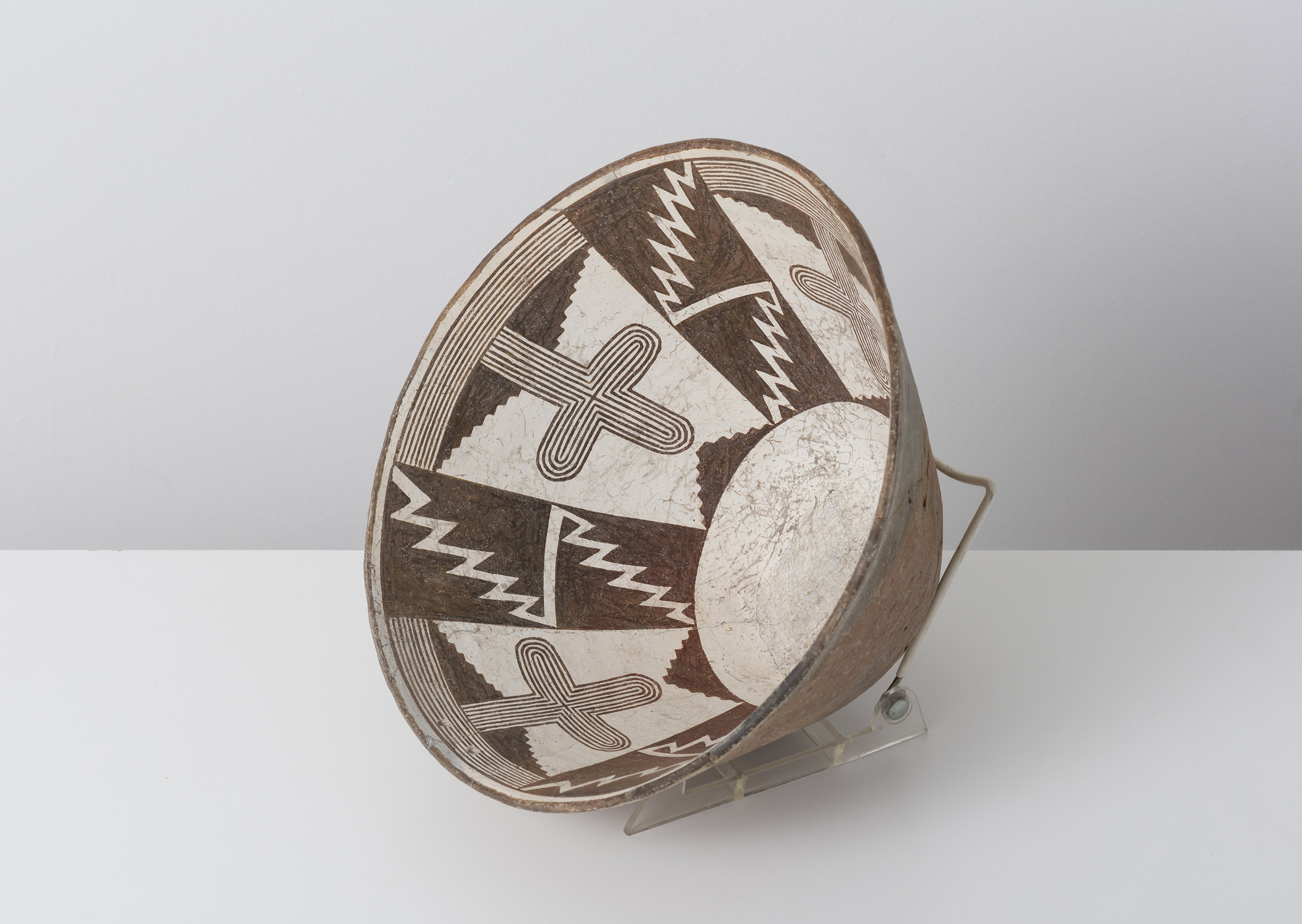   Classic Mimbres Black-on-white  Saguaro cactus and entoptic cross pattern c. 900 - 1000 CE Painted ceramic 11 inches diameter, 6 inches depth    