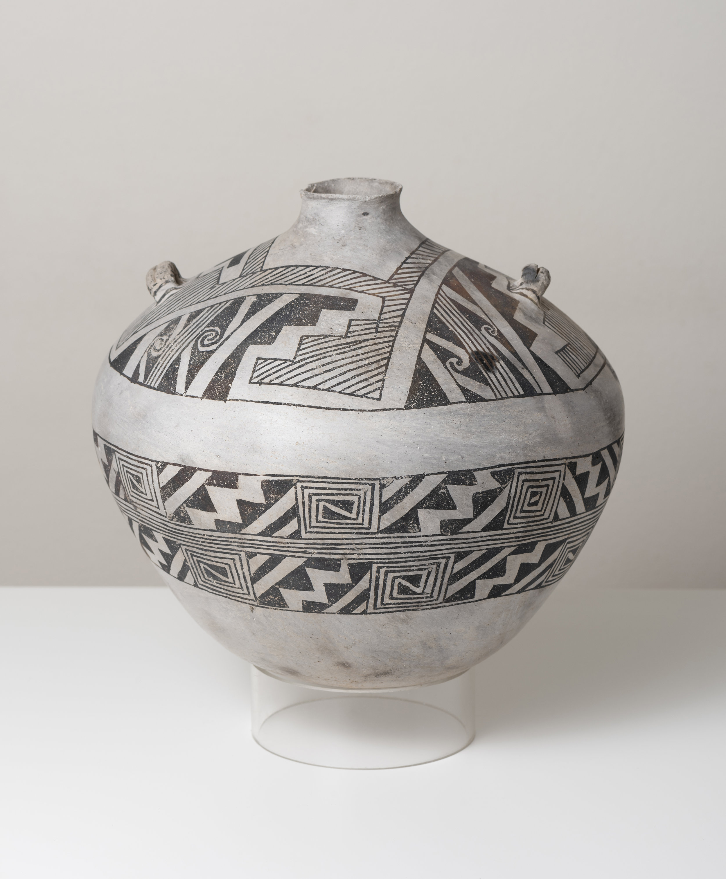   Socorro Black-on-white  Canteen c. 1100 - 1300 CE Painted ceramic 9 inches height, 10 inches diameter    