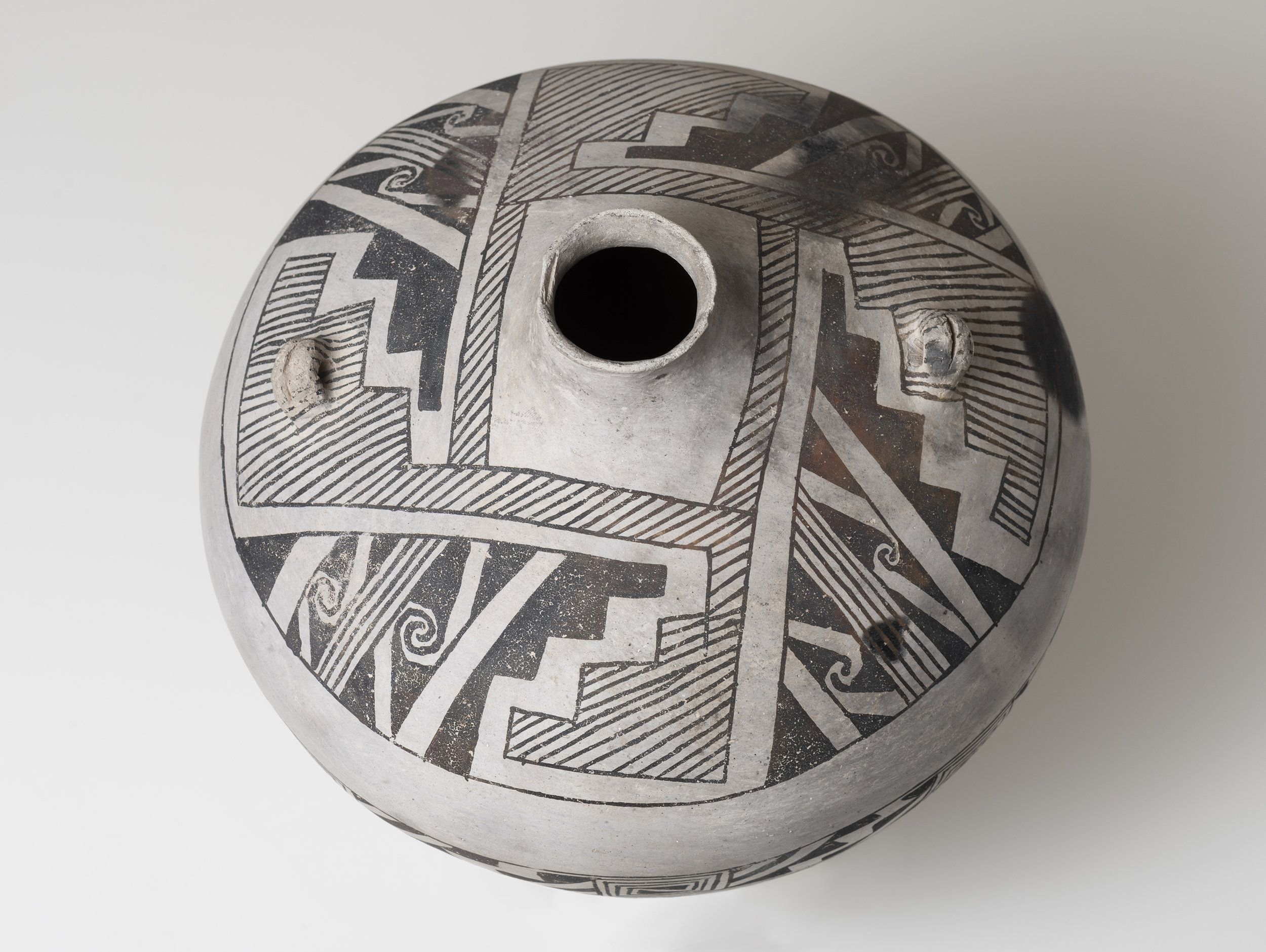   Socorro Black-on-white  Canteen c. 1100 - 1300 CE Painted ceramic 9 inches height, 10 inches diameter    