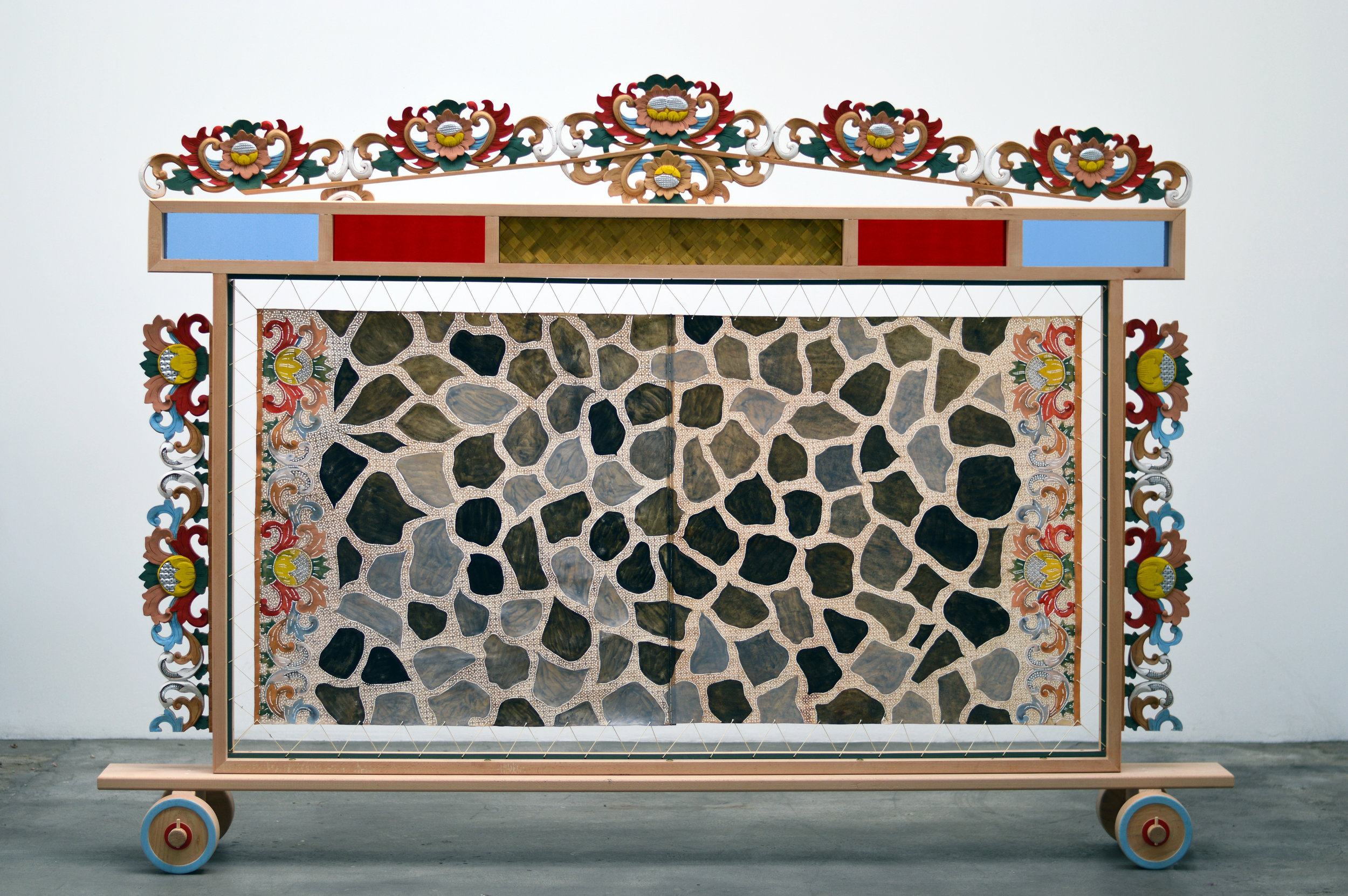 Adam de Boer Room Screen for Mohawk Street 2018 acrylic paint on hand carved hides, acrylic paint on hand carved teak, stained glass, and woven pandan leaf 74 x 96 x 16 inches