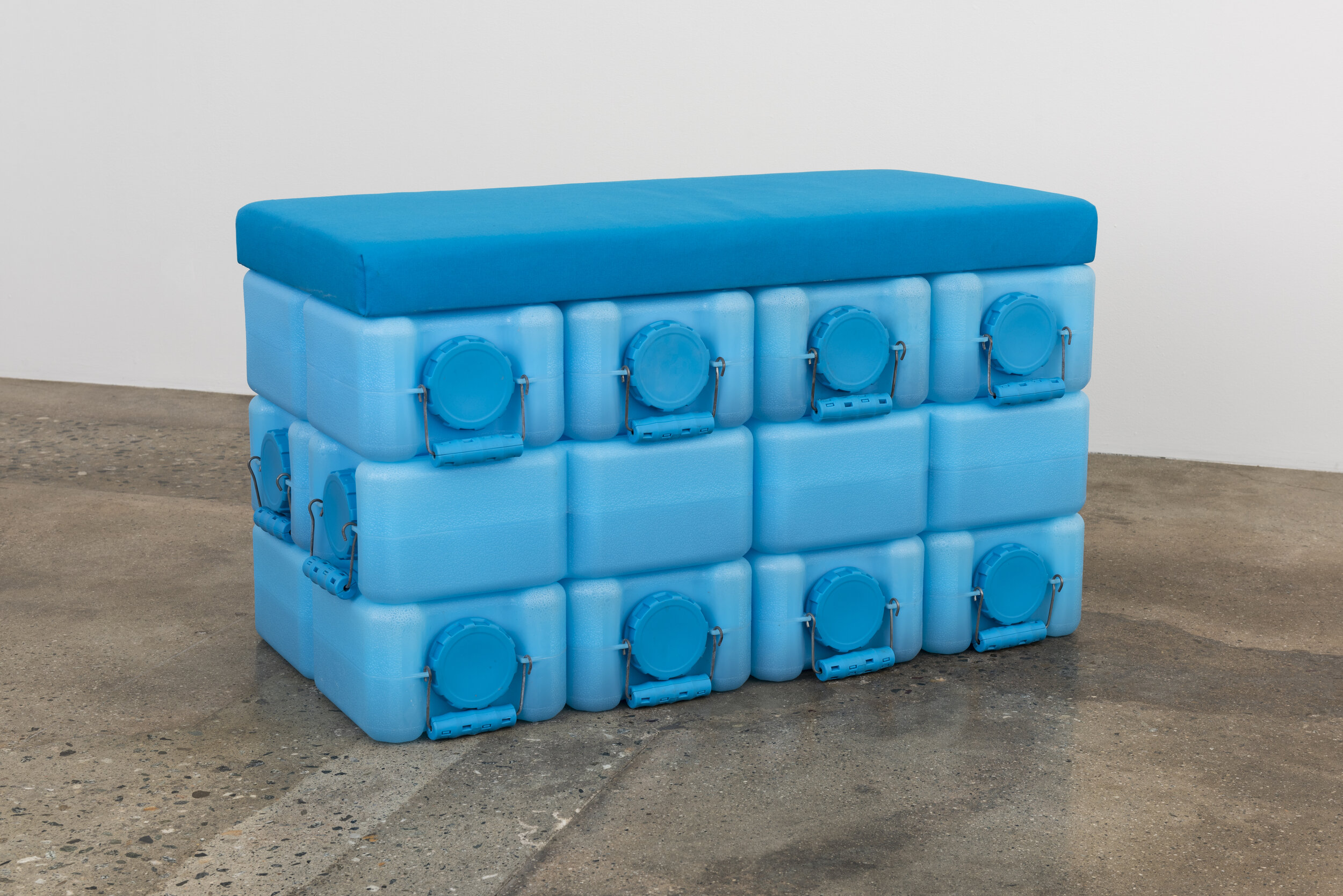   Colleen Hargaden   Water Brick (Loveseat)  2019 Water bricks, water*, handmade upholstered panels 18 x 36 x 21 inches  Photo by Ruben Diaz 