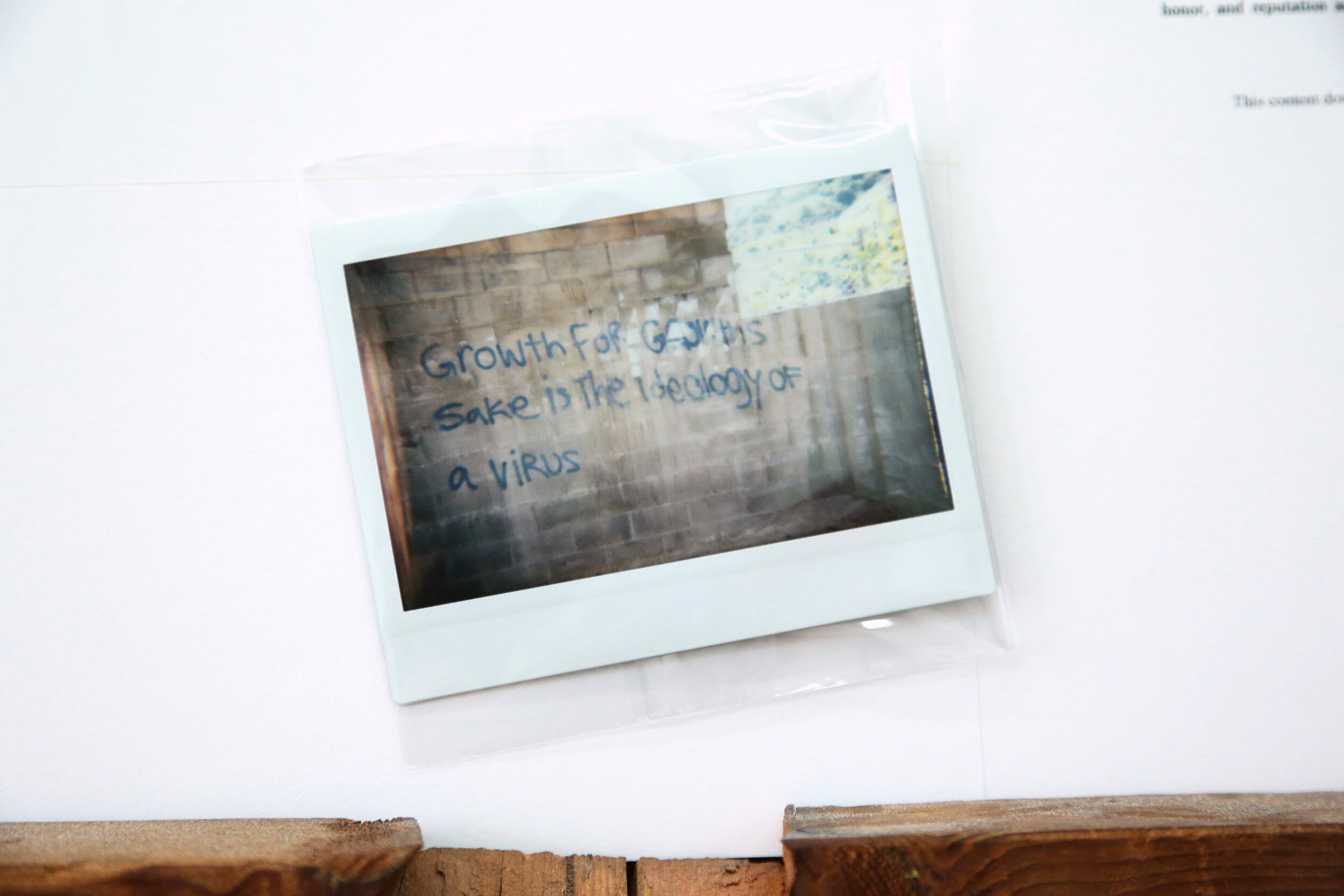 Detail view of   Tarik Garrett &amp; Kevin O’Neill   1  2021 Polaroids, inkjet prints on paper, wood 64 x 58 x 2.5 inches 