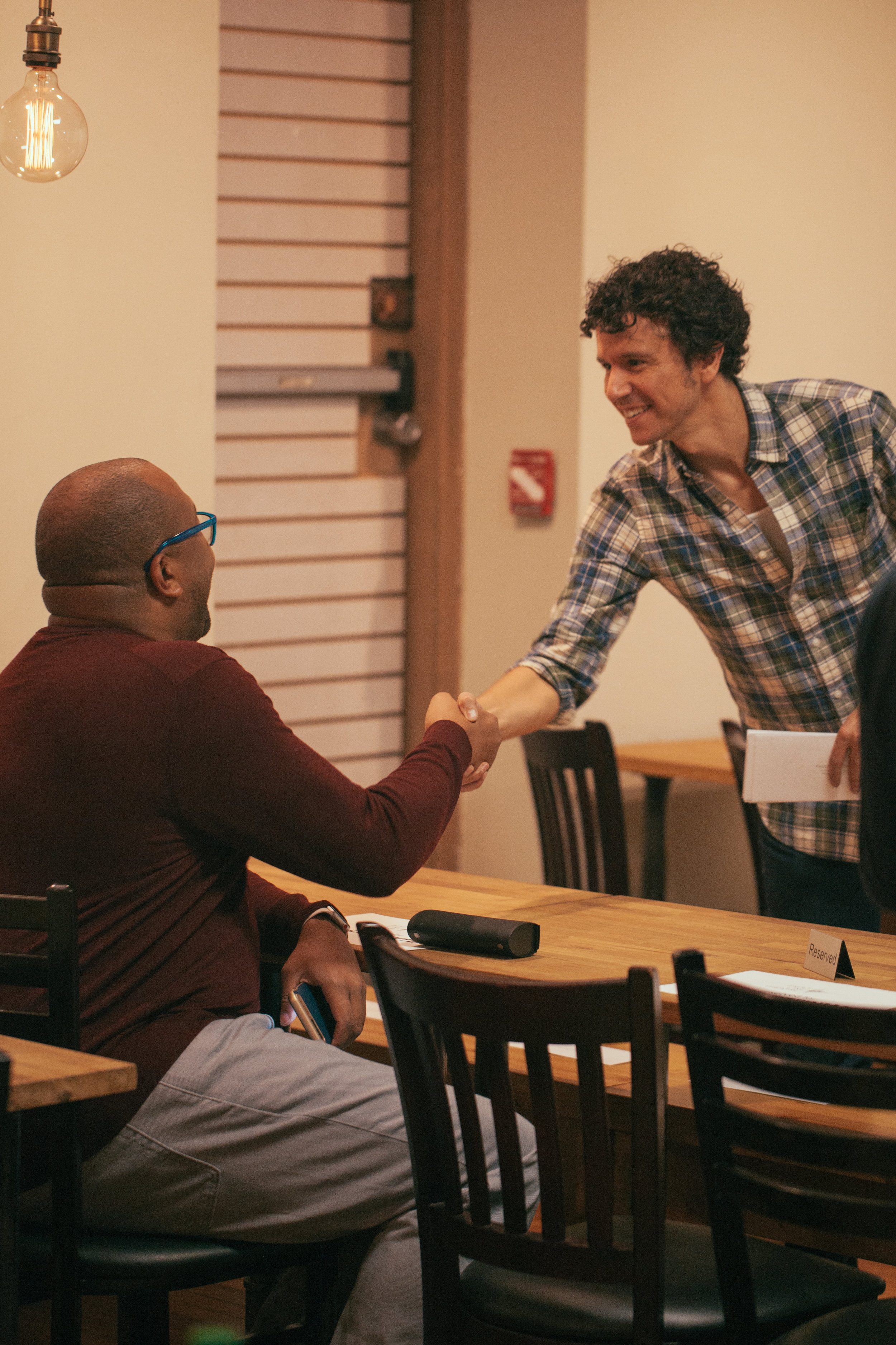  Co-Artistic Director Aaron Rossini greets an audience member.&nbsp;Photo by Katherine Oostman. 