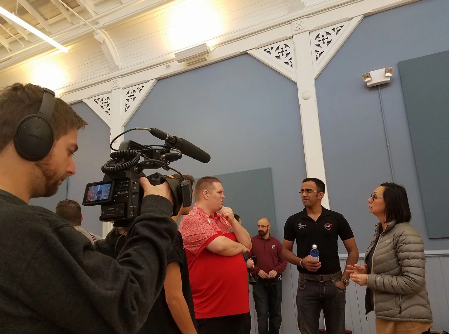 Dr Jonathan Corey (University of Cincinnati) talks with Sid Thatham (UC Hyperloop) and Lorrie Platt (OKI Council of Governments) following the Smart Cincy roundtable luncheon at Union Hall on March 15th. 