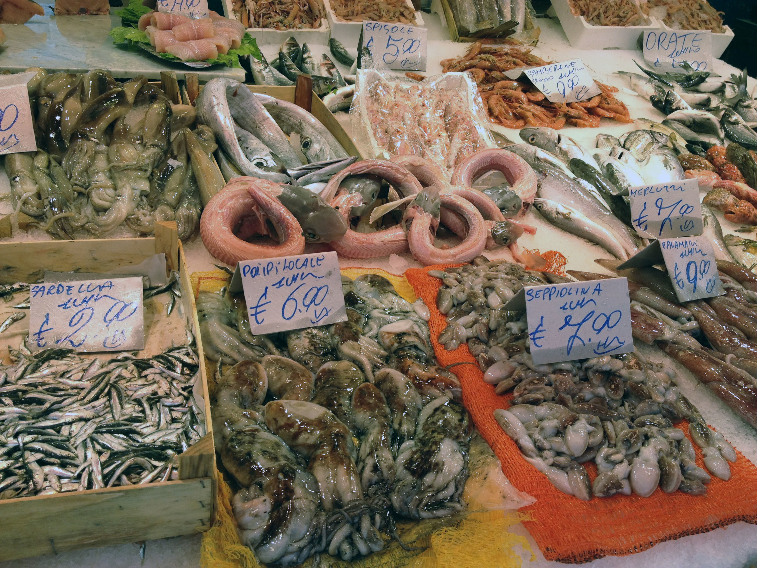 Wish we could include the sounds of the vendors at the market in Palermo bellowing out the wonders of their products but, alas, bandwidth does not easily allow such extravagance. Imagine fresh carciofi (artichokes with delicious edible stems featured above) costing 0.15 Euros per Kilo (that's about .08 cents US per pound)...Heaven!