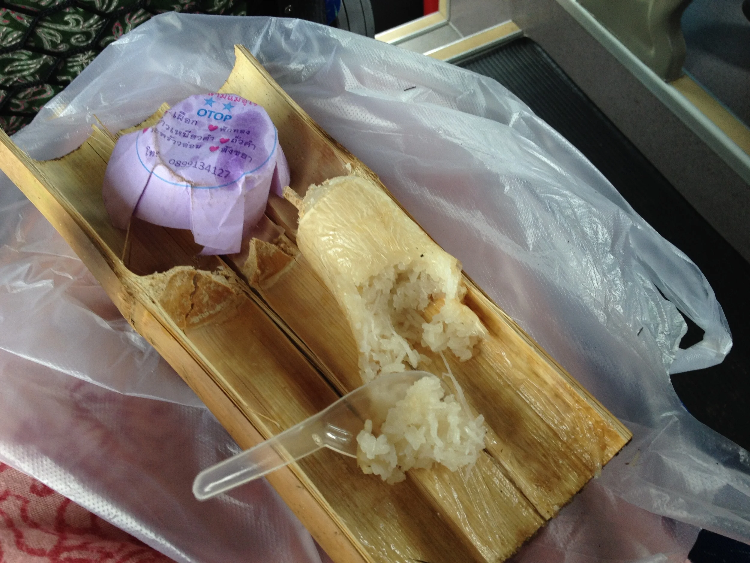 These were delicious. They take bamboo and stuff them with sweet sticky rice mixed with either beans or coconut or pumpkin or some mixture thereof and cook/steam over hot coals.