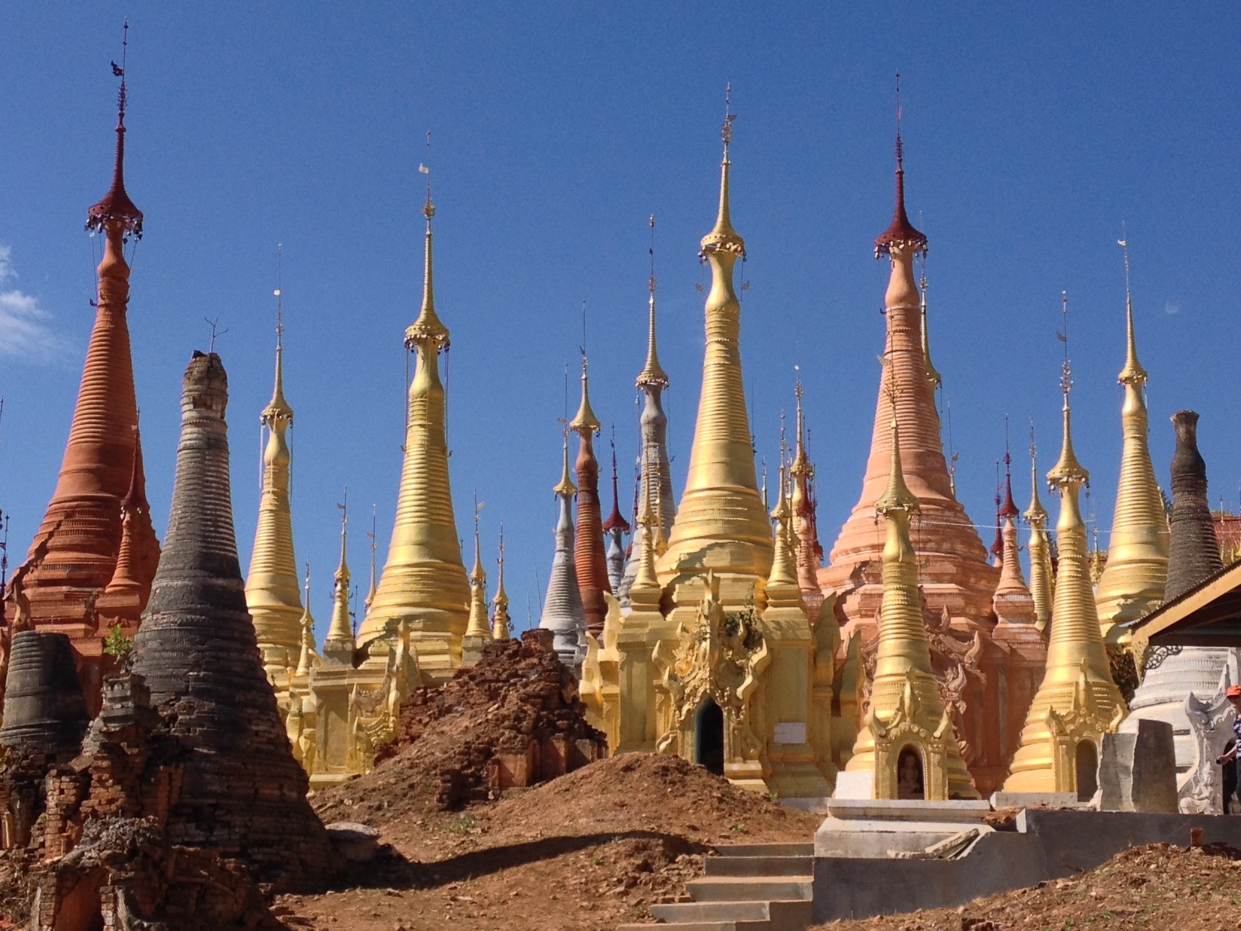 At a remote site located near a Shan tribe village on Inle Lake, 1068 small shrines and stupas surround a pagoda on the top of a hill. The fascinating landscape seems whimsical and reminiscent of an illustration out of a Dr. Seuss book.