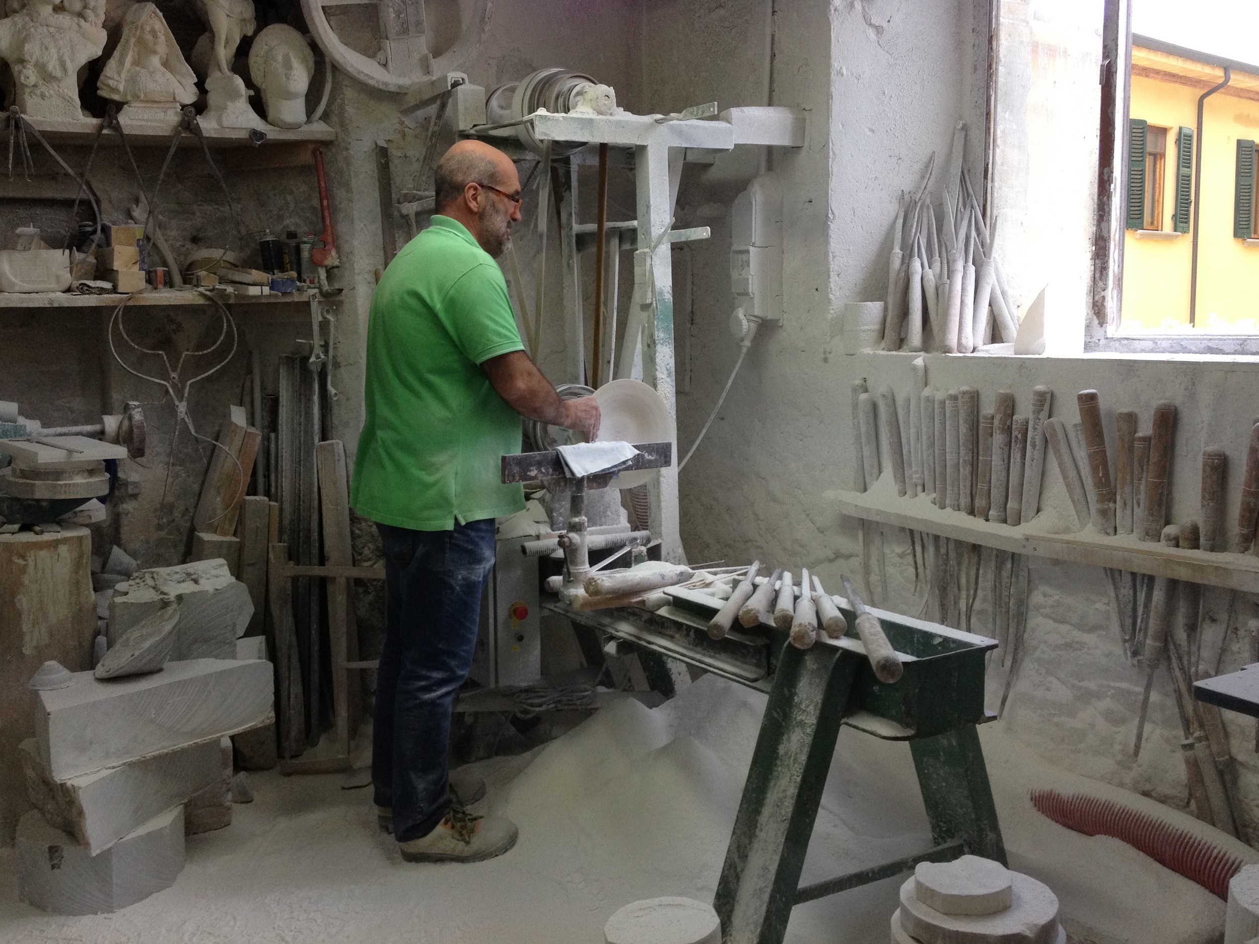 Volterra. An alabaster workshop. Notice the piles of dust below the worker. The interesting thing is that none of them wear masks. Not surprising in a country where Camel sponsors a very crowded smoking room at the airport and, to our dismay, it seems like almost everyone smokes.
