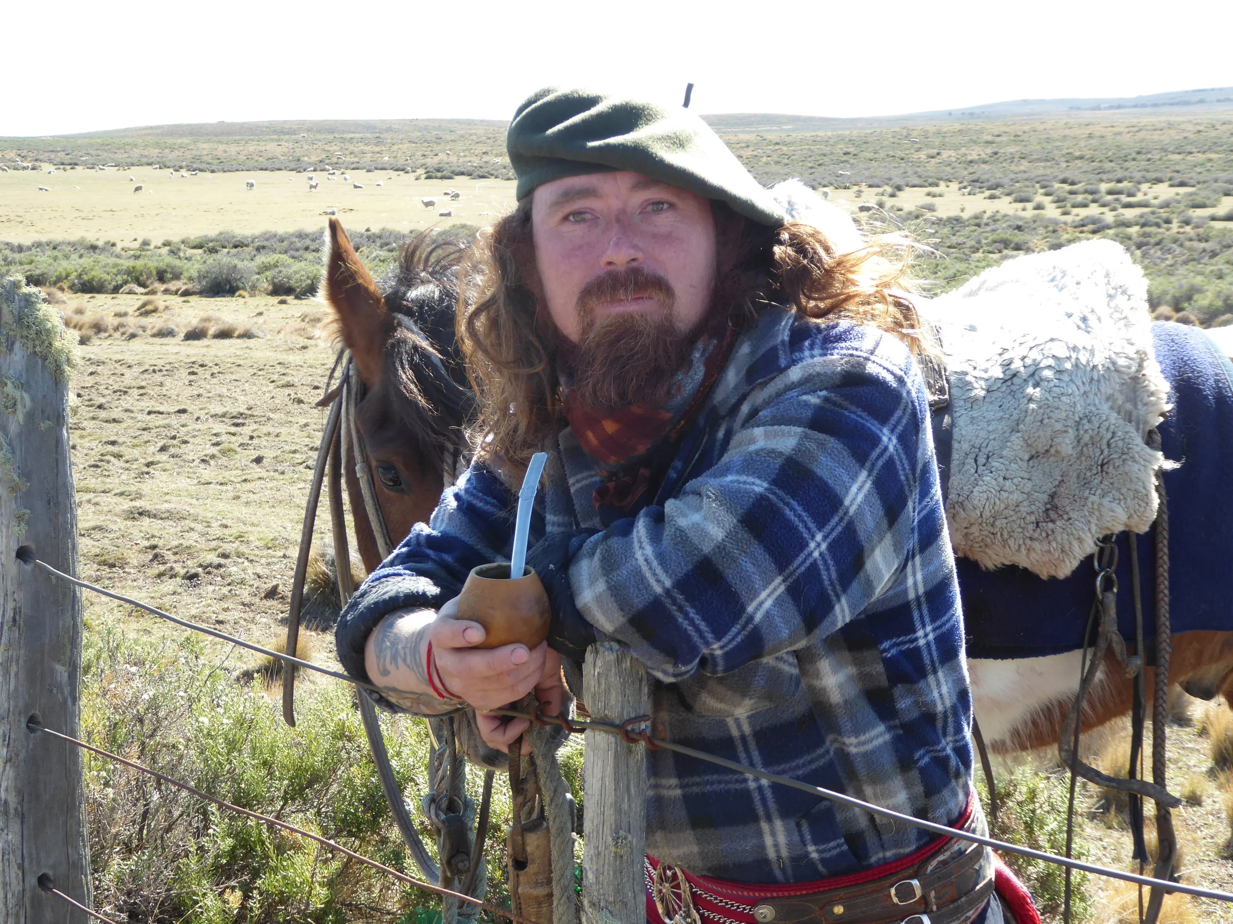 Colorful gaucho poses with his mate in a truly GQ moment.