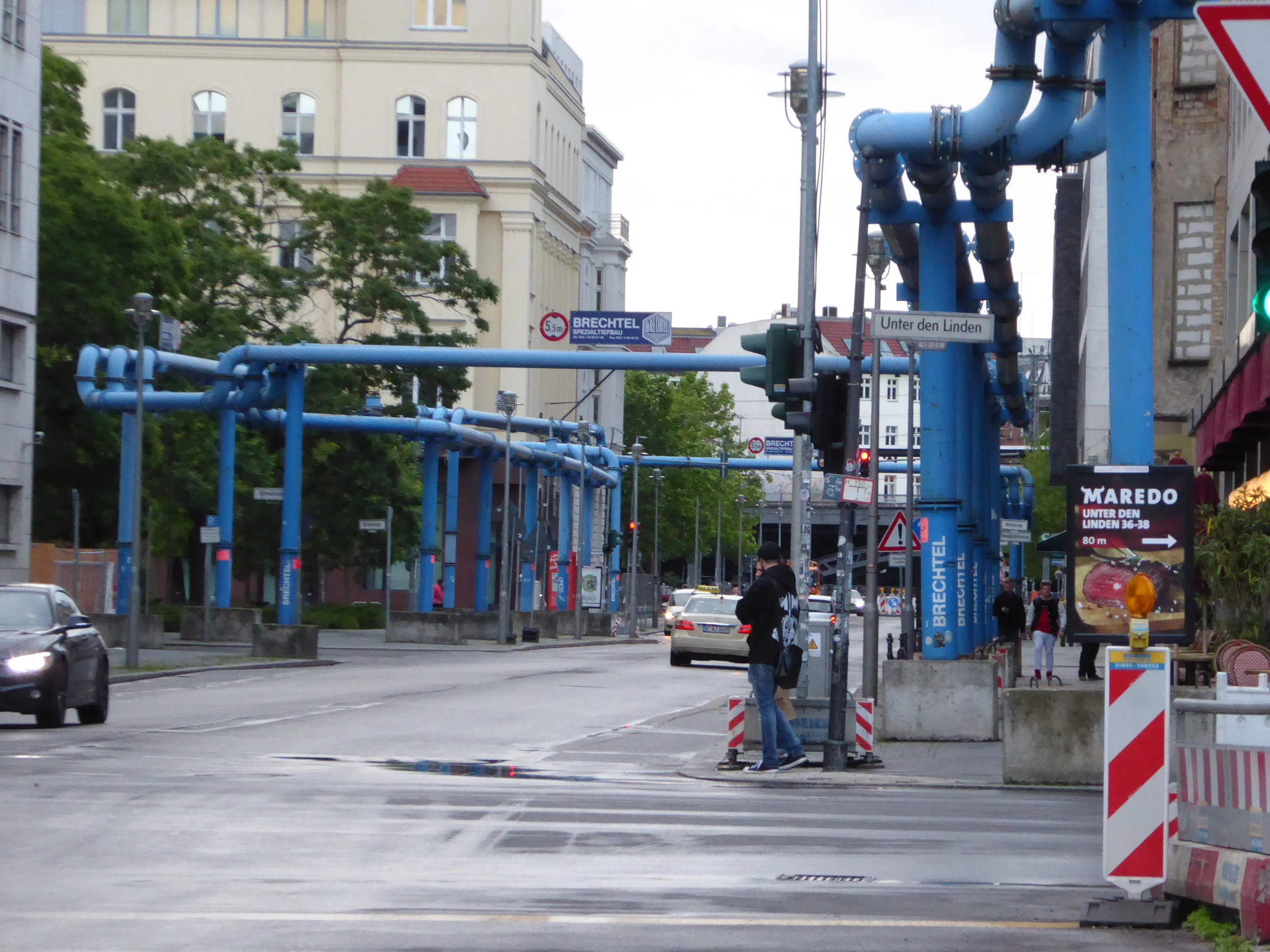 Built over a marsh, whenever there is major construction in Berlin, as in the case of a new U-bahn line, the high water table necessitates the pumping away of water, hence these blue pipes running along the street.