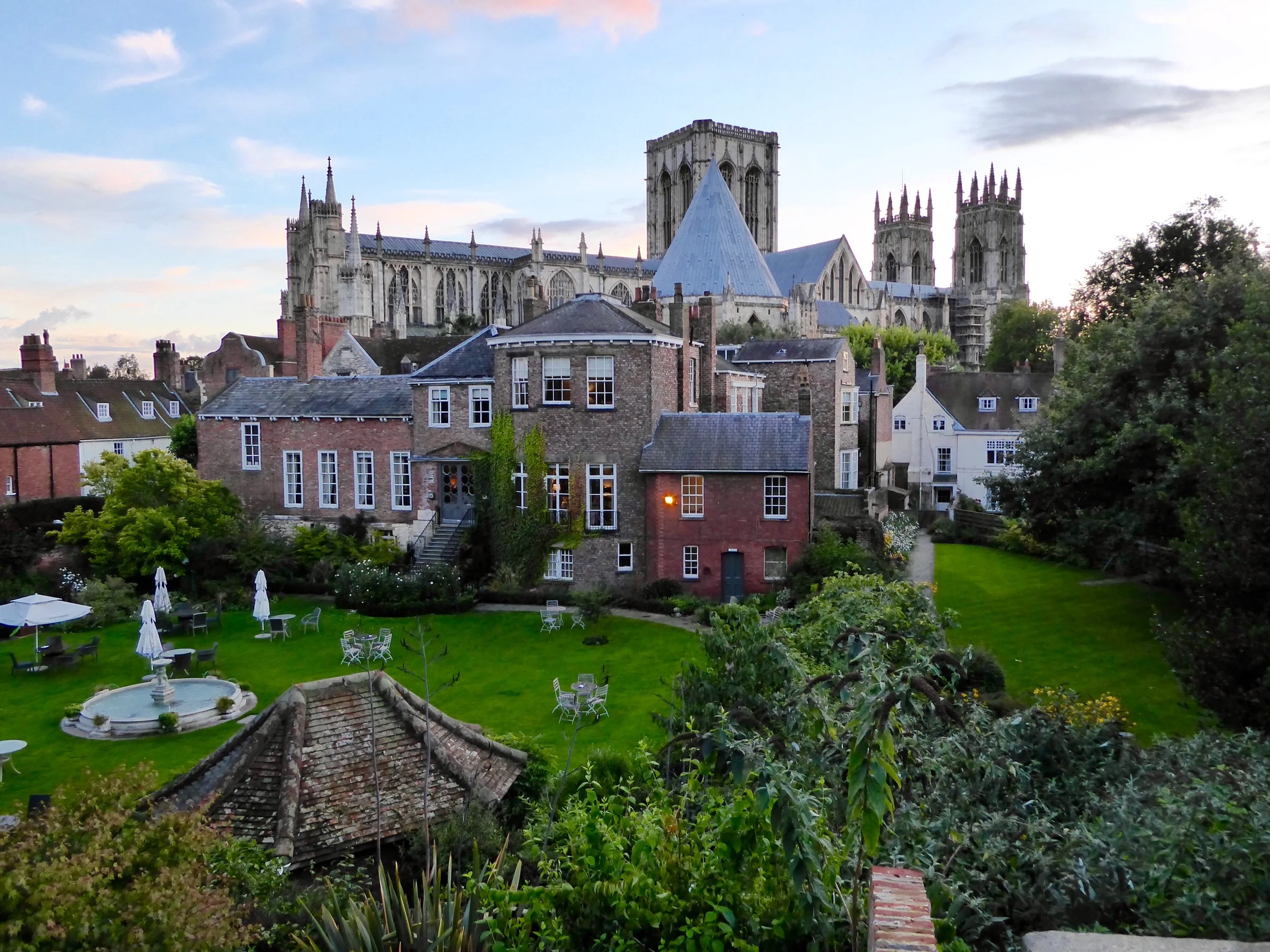 The sun sets in York as we walk the Medieval wall around the city and stop in to this hotel with Ellen's concerns regarding a distressed dog trapped in a stone holding pen in between the wall and their yard. Everything immediately came to a stop despite a very busy bar, as a hotel rescue party was organized. The English absolutely adore their dogs.