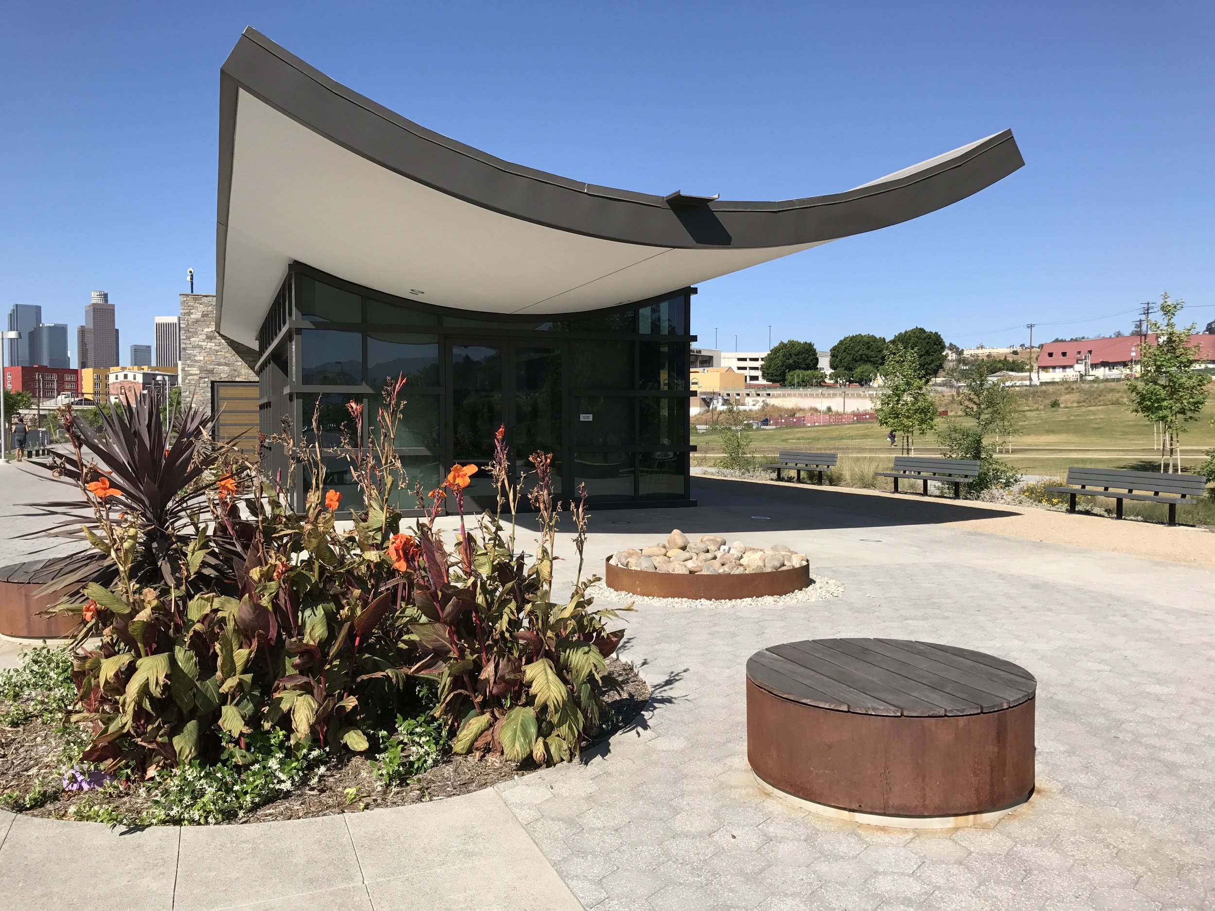 The concave roofs of the park buildings channel rain water through stone-covered grates into underground cisterns.