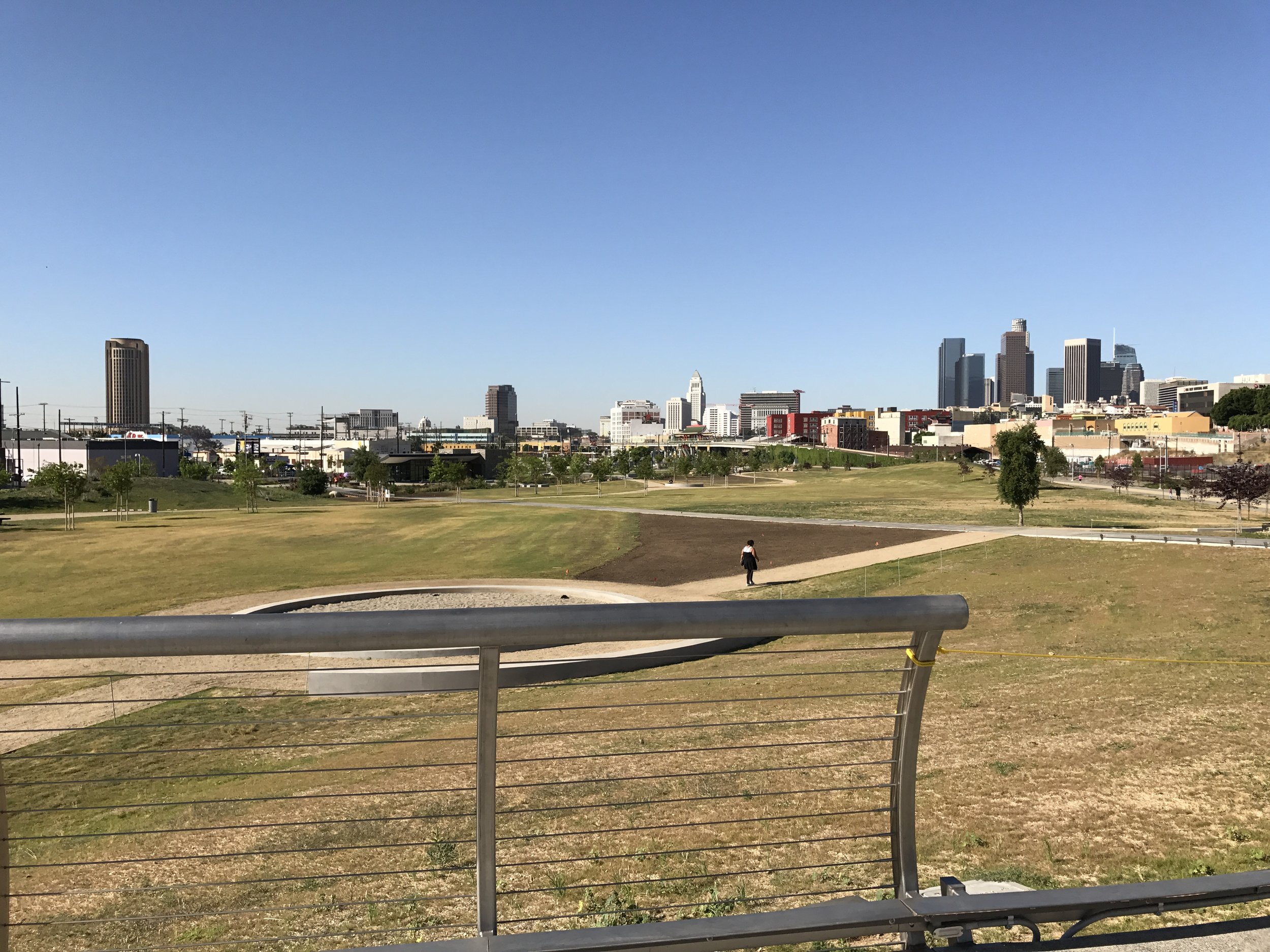 The elevated walkway provides views of the downtown skyline.