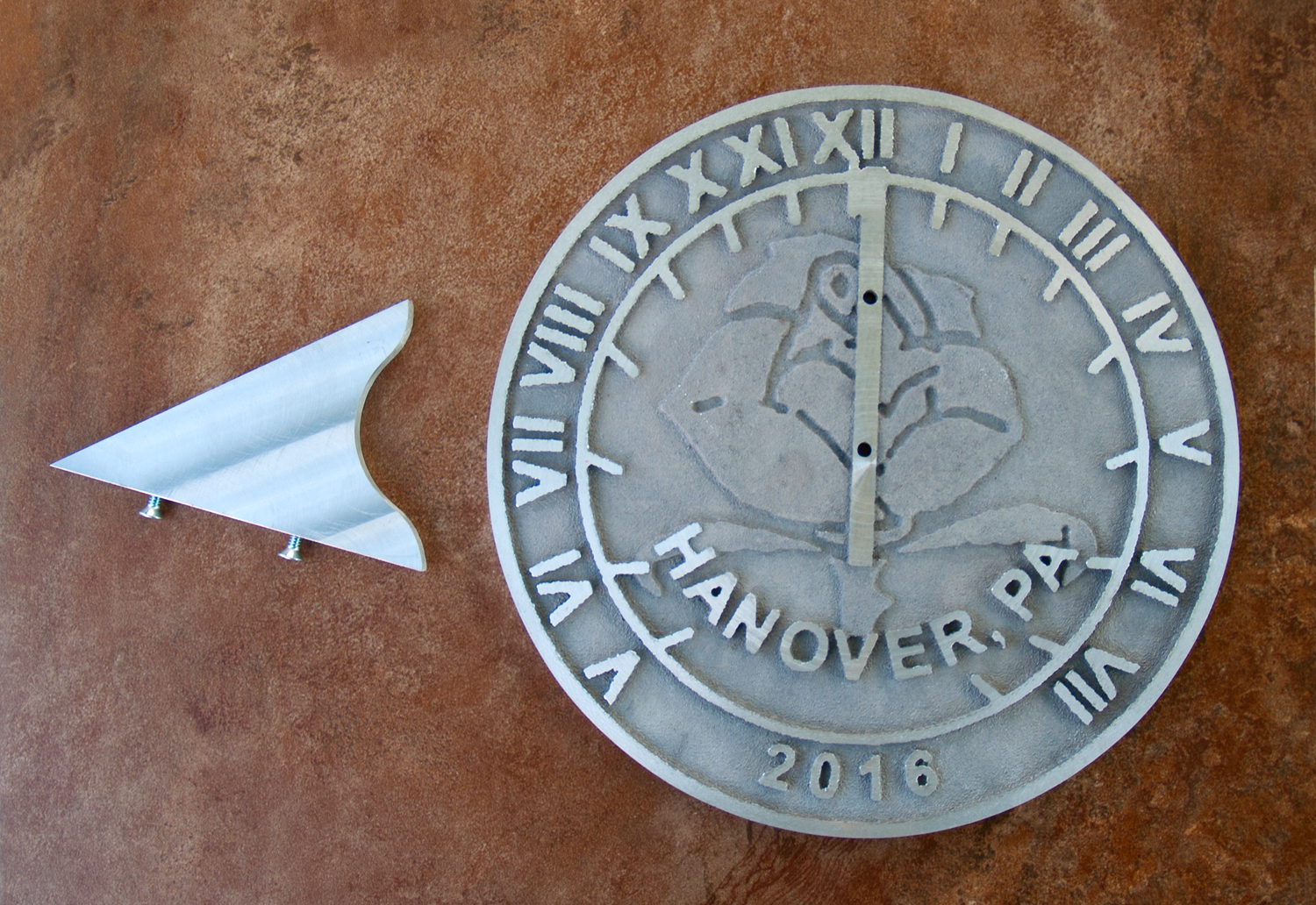 Completed sundial and gnomon.