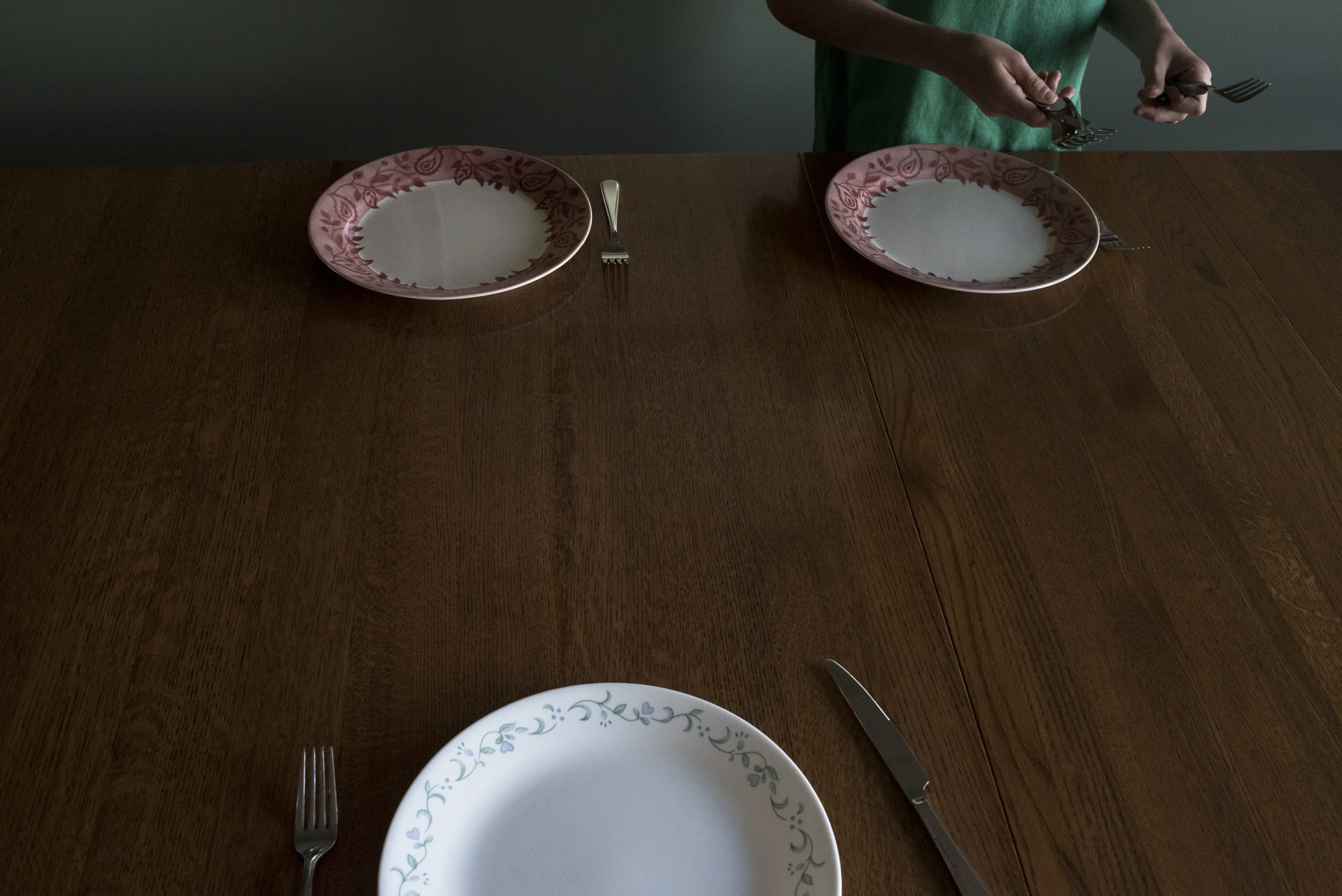  Keaton, 12, sets the table before having dinner with his brothers and sisters. Having dinner with the whole family is far and few between because of everyone's different schedules. 