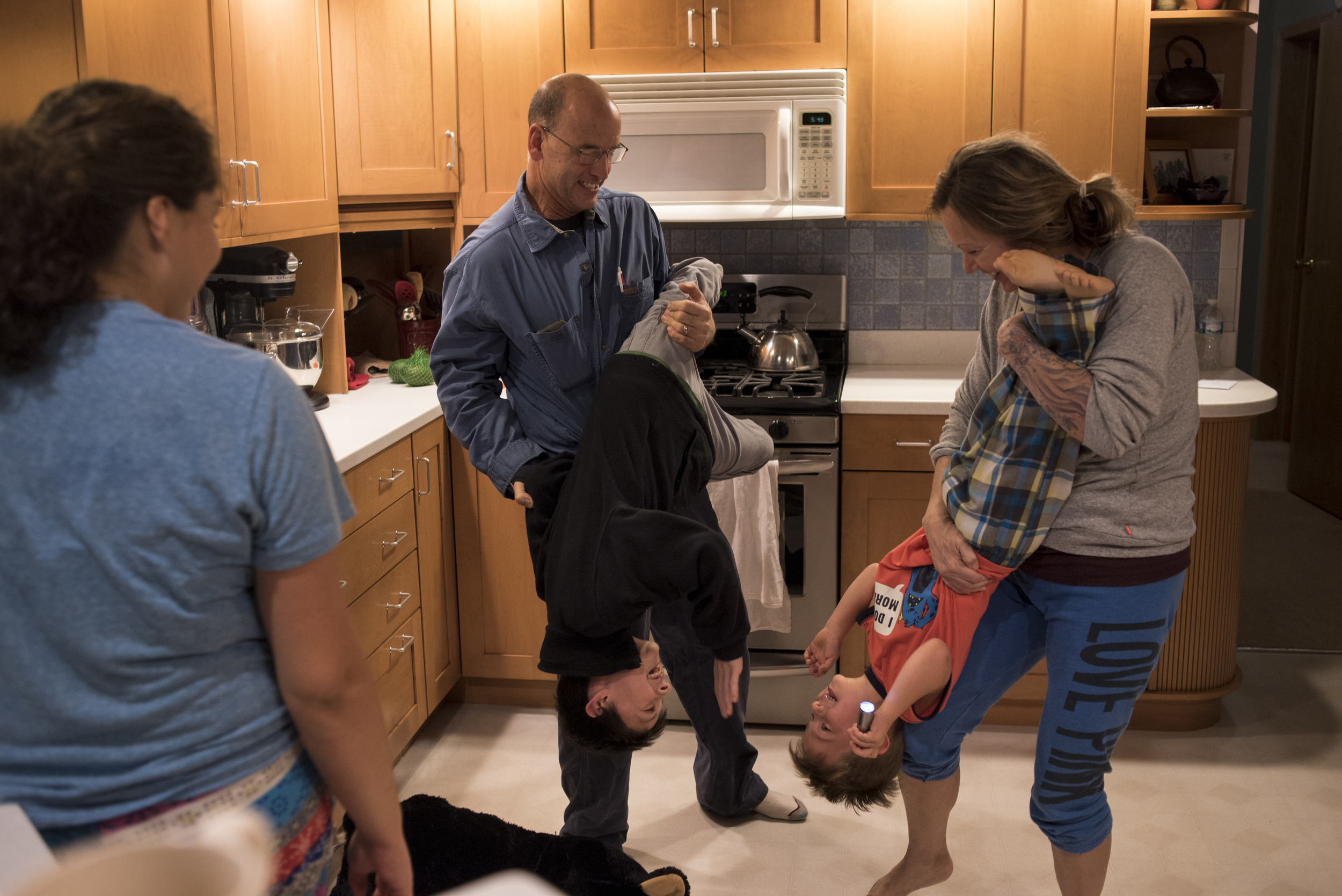  Lyle and DJ play with their sons Keaton and Levi in their kitchen after dinner. “Having your siblings with you, there’s no one else that knows what its like to be related to and come from the people you come from,” said DJ. “So, when you’re struggli