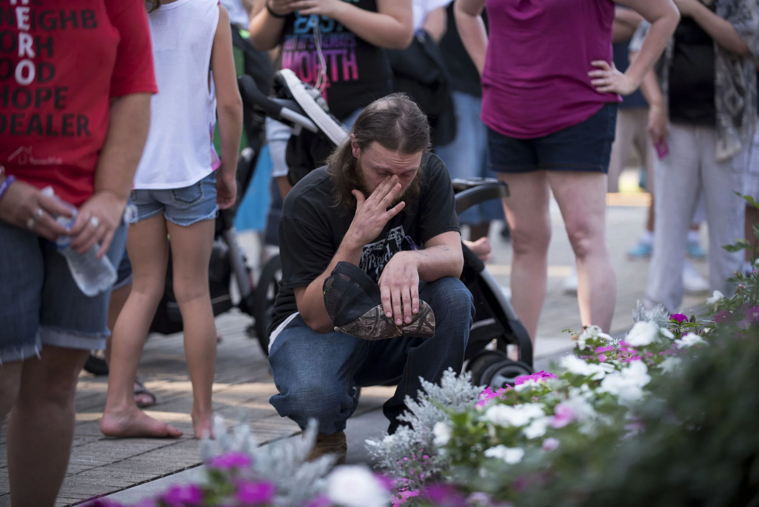 Ryan Fieldman, 33, kneels during the opening prayer at the West Virginia Overdose Awareness Day Tribute at the State Capitol in Charleston, WV on August 27, 2016. Ryan is currently in recovery at Jacob's Ladder in Aurora, WV.