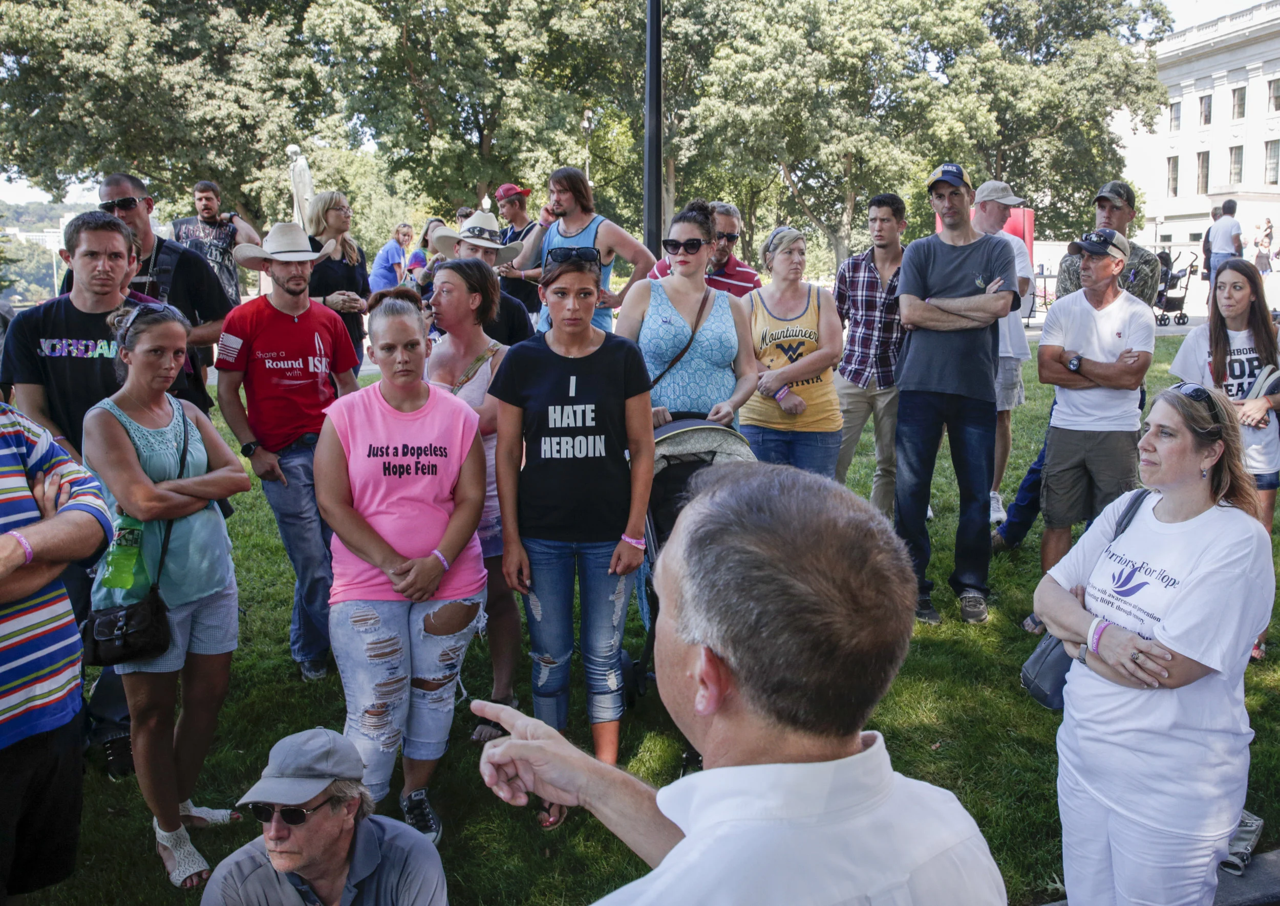 Dr. Michael Brumage of the Kanawha-Charleston Health Department demonstrates how to perform naloxone adminstration to a crowd of people at the West Virginia Overdose Awareness Day Tribute in Charleston, WV on August 27, 2016.