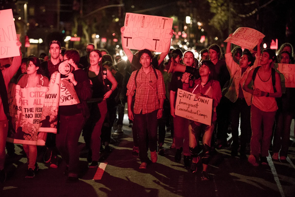 UC Berkeley students march through downtown Berkeley in protest of President-elect Donald Trump on November 10, 2016. Chants of "Immigrants are here to stay!" reflected the groups demands to defend sanctuary cities and campuses and shut down immigrant detention centers in the United States.
