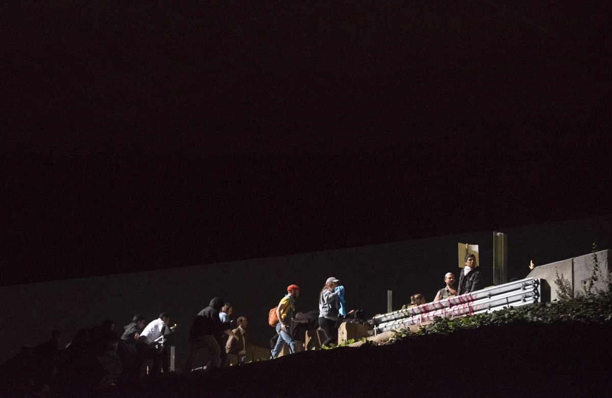 President-elect Donald Trump protesters broke through freeway fencing and attempted to take Interstate 580, but were stopped by riot police in downtown Oakland on November 10, 2016.