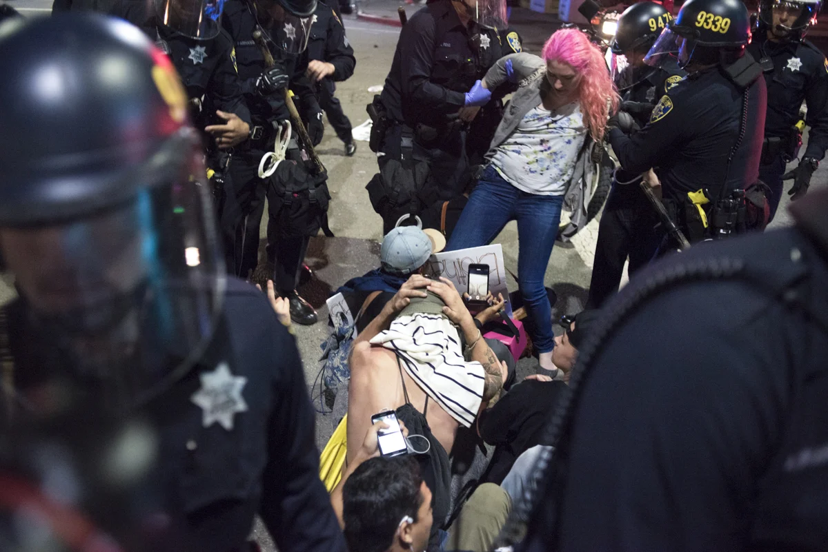 Protesters are arrested by Oakland Police Department riot police in the late hours of an anti-Trump protest that filled the streets of downtown Oakland on November 9, 2016.