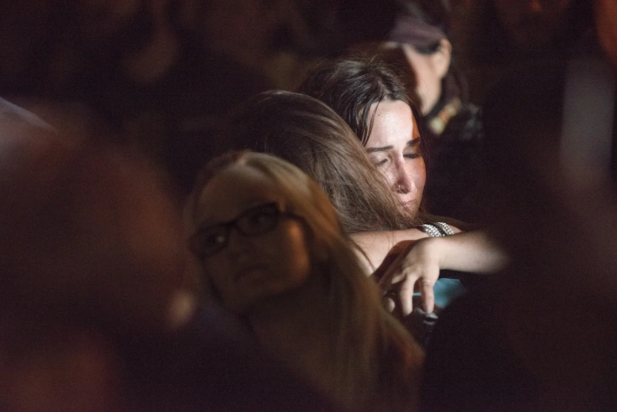 Two protesters embrace during the first hour of the anti-Trump protest at Oscar Grant Plaza in downtown Oakland on November 9, 2016.