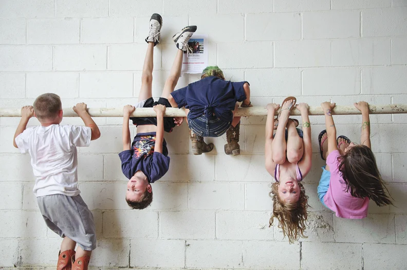  Competitors in the kid's tractor pull competition take a break during rounds to hang out at the Washington County Fair in Washington, Pennsylvania on August 10, 2013. 