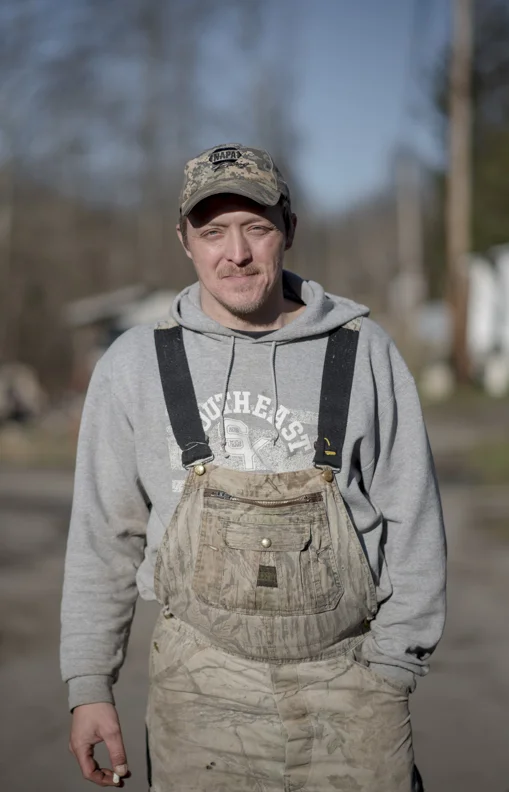  Coy Riley, who was laid off from his coal mining job, outside of his home in Jenkins, KY. 