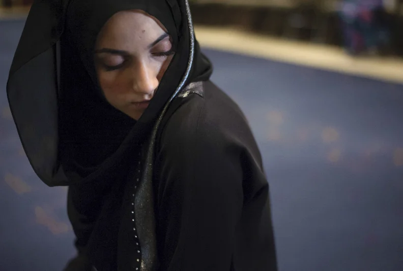  Mariam Aboukar, 25, of Dublin, Ohio, finishes her afternoon Dhuhr prayer by looking to the left at the Noor Islamic Cultural Center in Dublin, Ohio on December 1, 2013. 