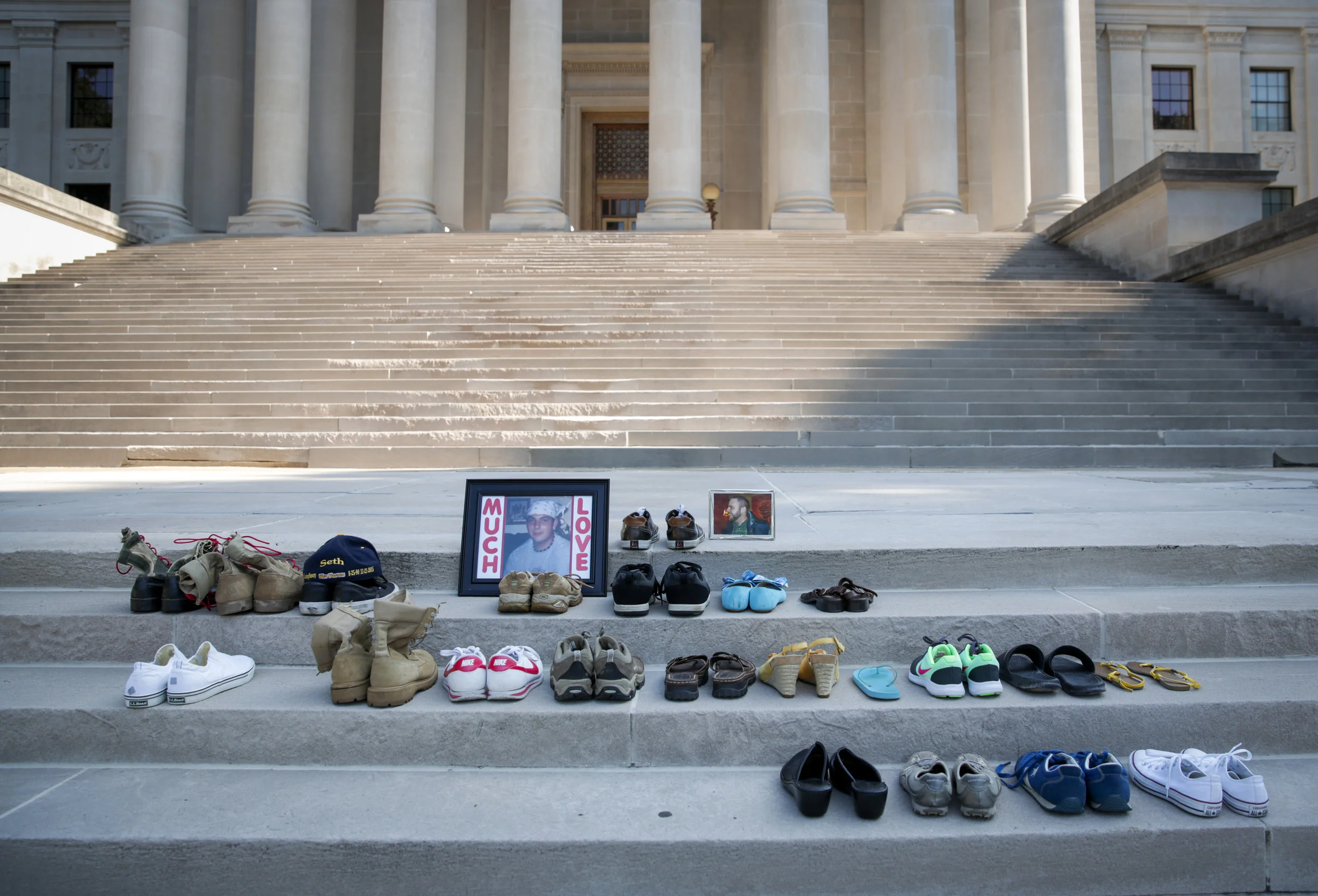 Shoes of family and friends who died from heroin overdoses rest upon the steps of the State Capitol in Charleston, WV at the start of the West Virginia Overdose Awareness Day Tribute on August 27, 2016. 