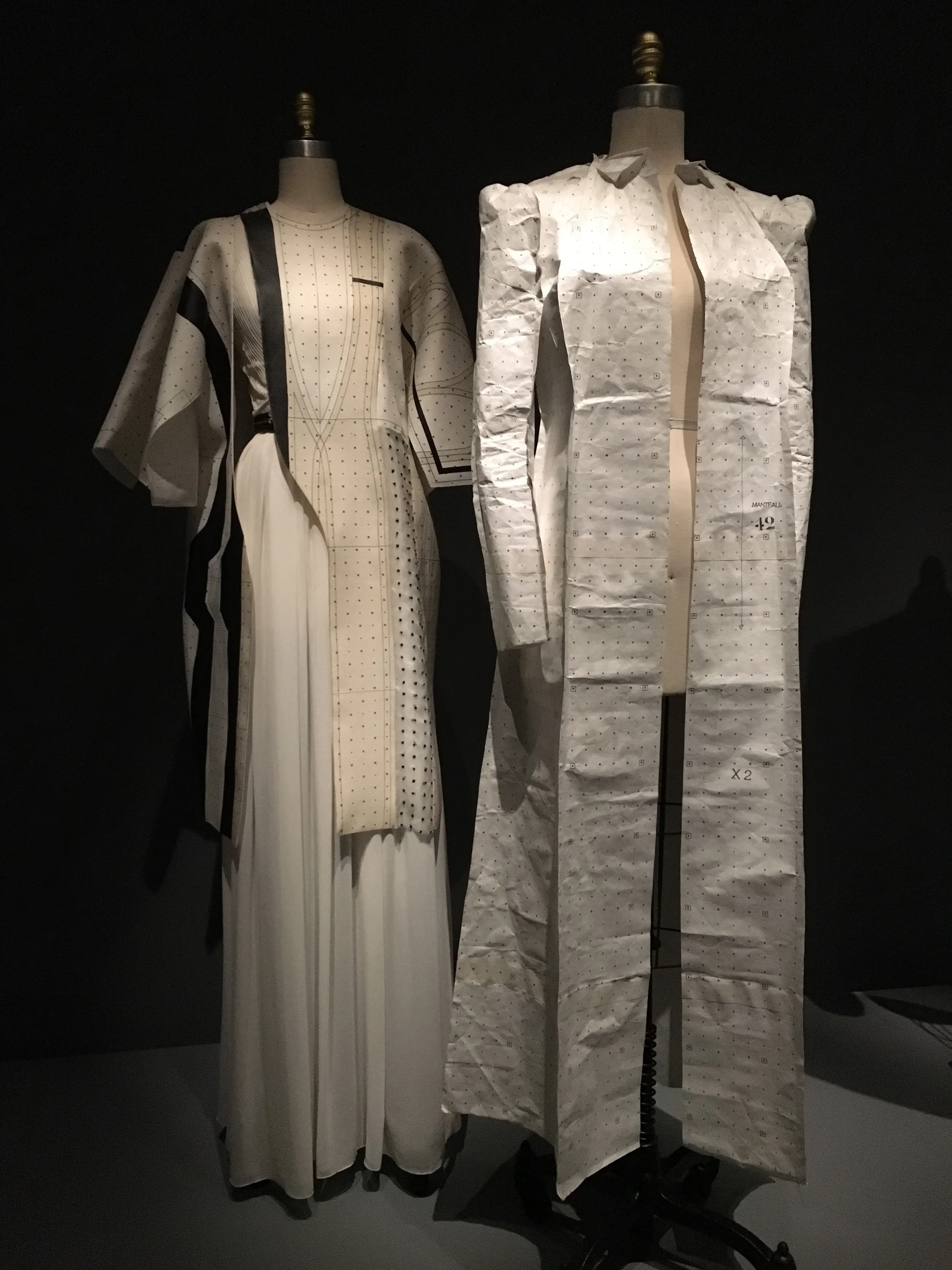 Hussein Chalayan SS 2014, demi-couture Machine-sewn white silk organza and white silk compound weave, printed à la disposition with black and cream-pattern-drafting-paper motifs, hand-embroidered in black silk yarn with dot and cross motifs
