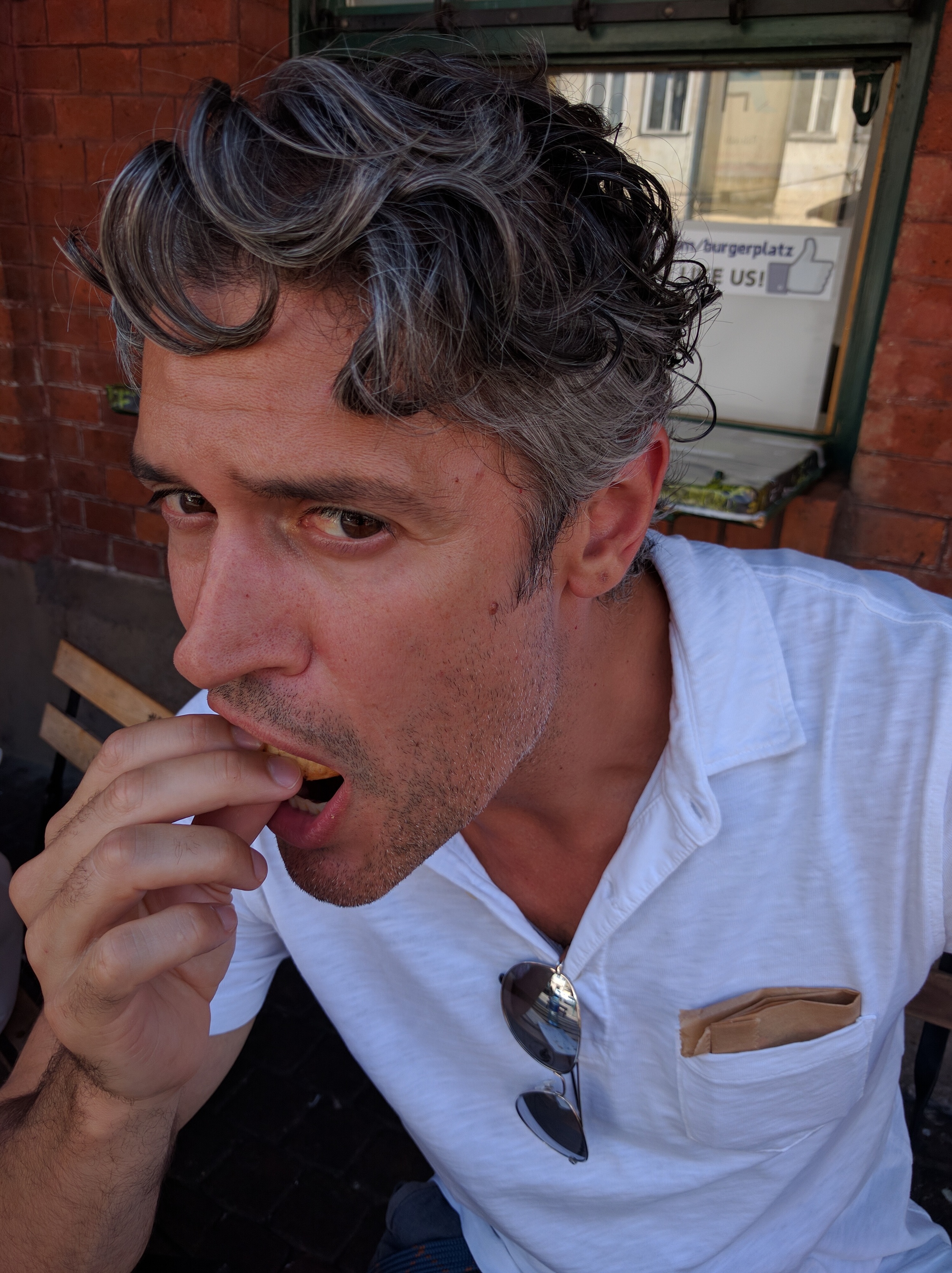 Finishing off my first zapiekanka... the thumbs up behind my head says it all.