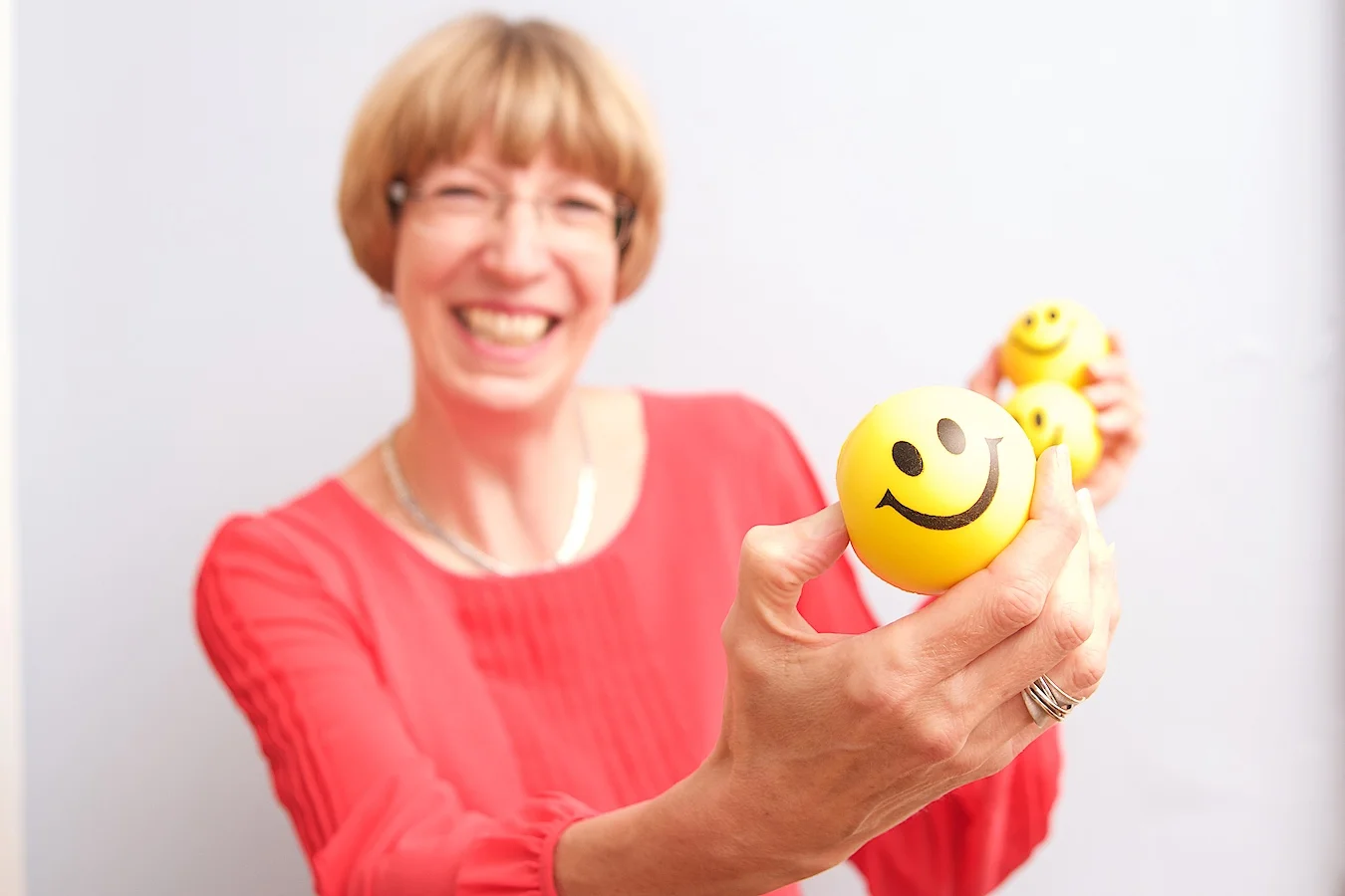 Alison with a smiling yellow toy showing her passion for health and safety