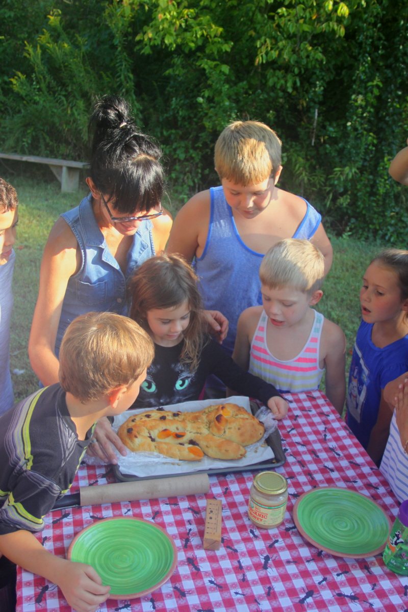 Ki Kelly & Logan create a bread dragon for the HomeSchool group email.jpg