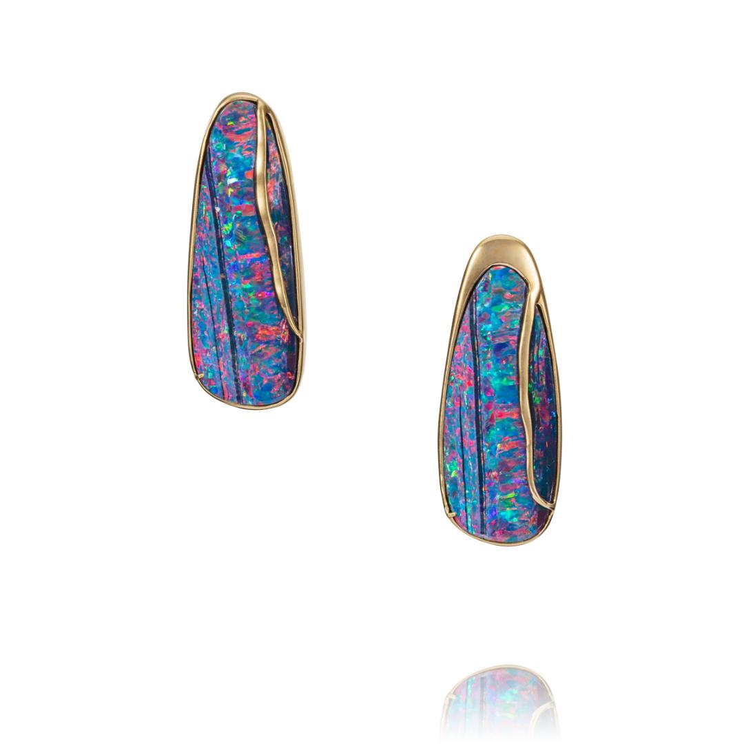 Boulder opal set in 18kts gold earrings.