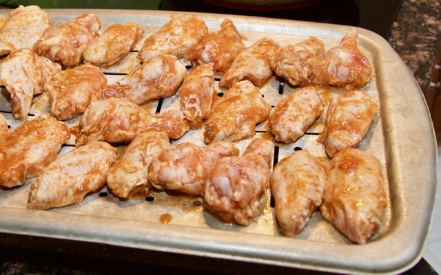 Satay chicken wings on broiler pan